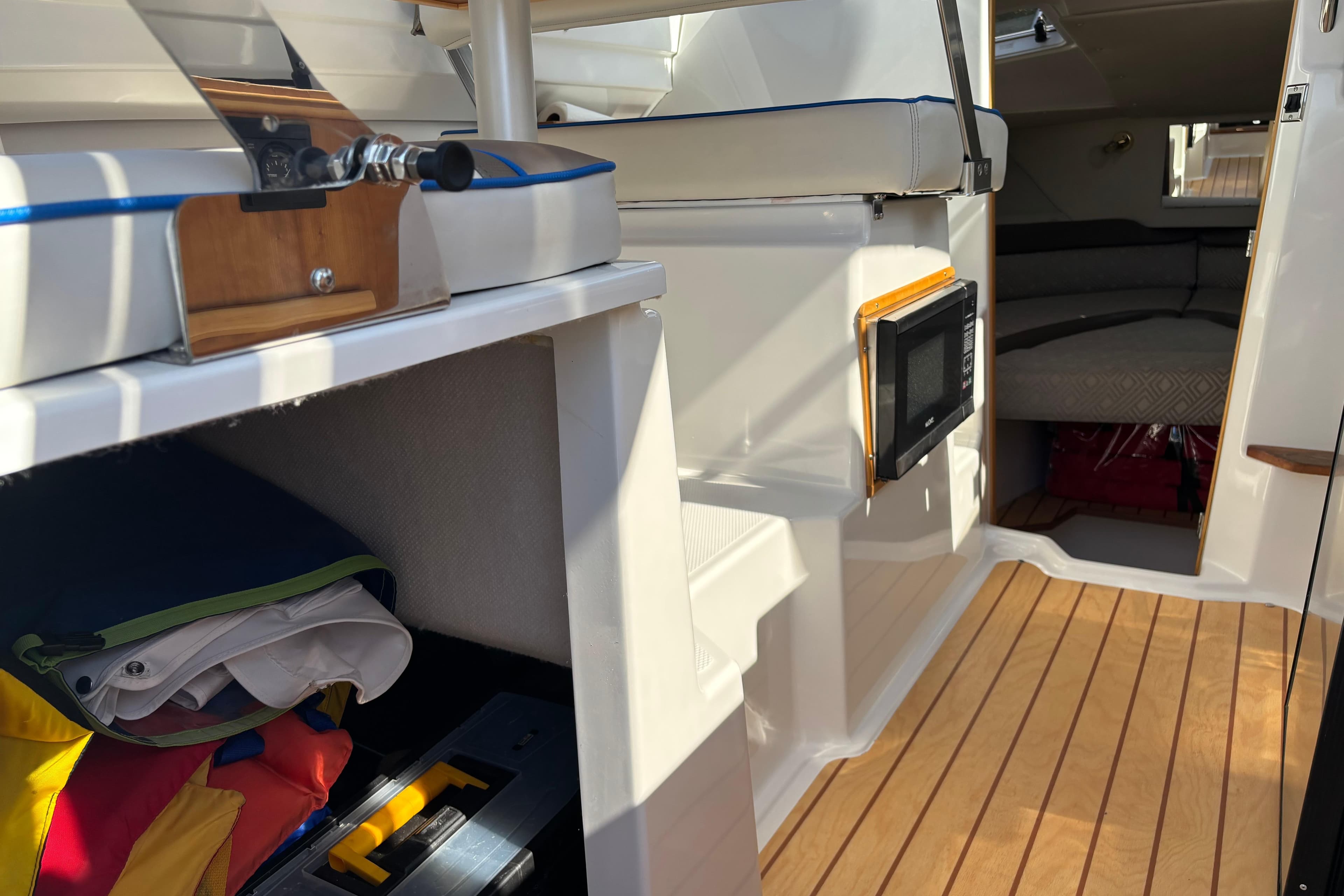 Interior view of 2017 Cutwater C-242 Coupe boat, featuring seating and storage.