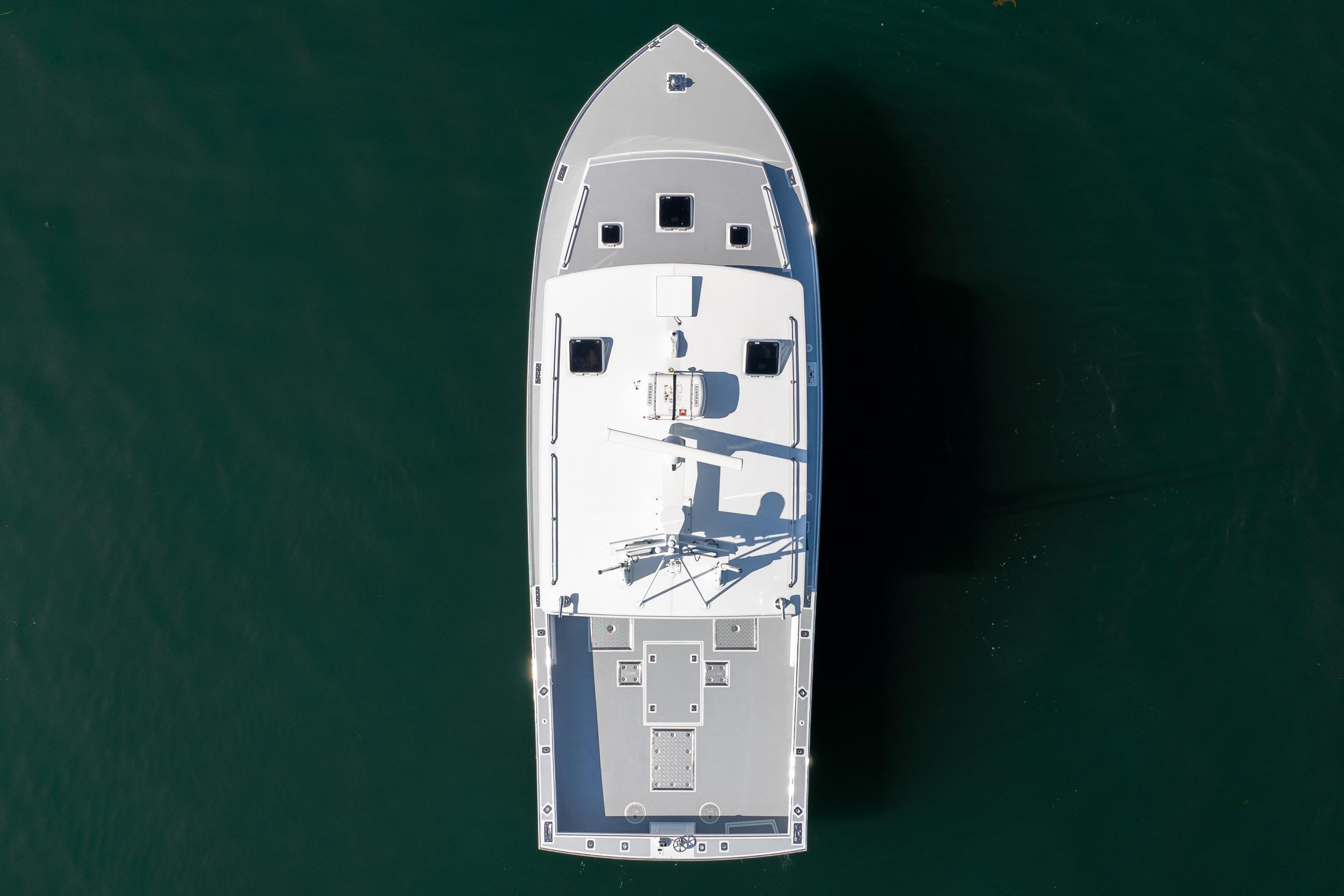Aerial view of 2025 Mussel Ridge 42 boat on calm water.