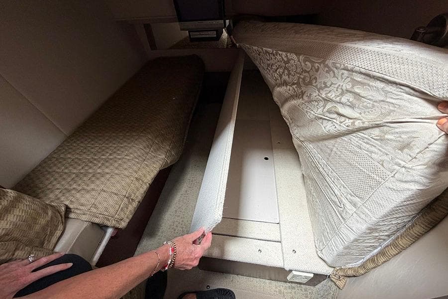 Interior view of 2008 Sea Ray 36 Sedan Bridge showing under-bed storage space.