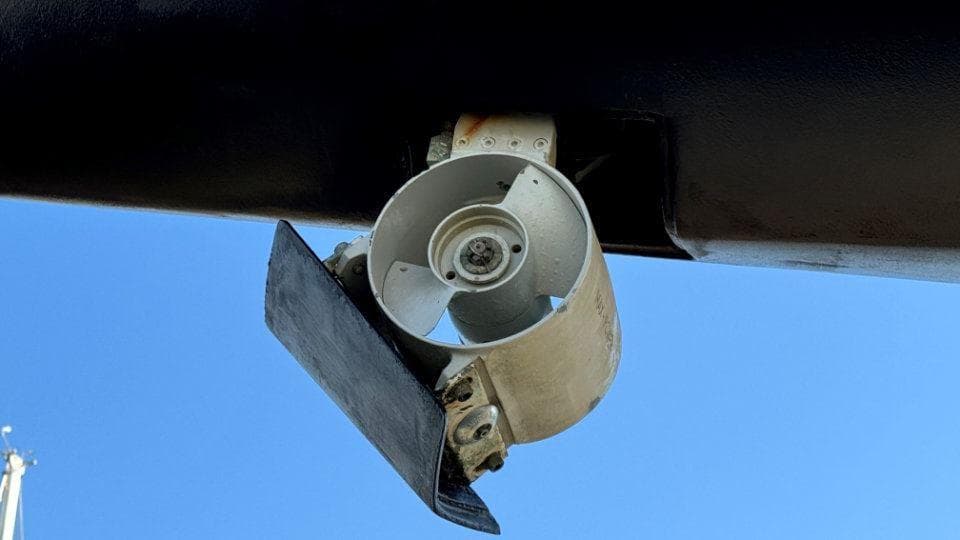 Bow thruster of a 2000 Nautor Swan 60 yacht against a clear blue sky.