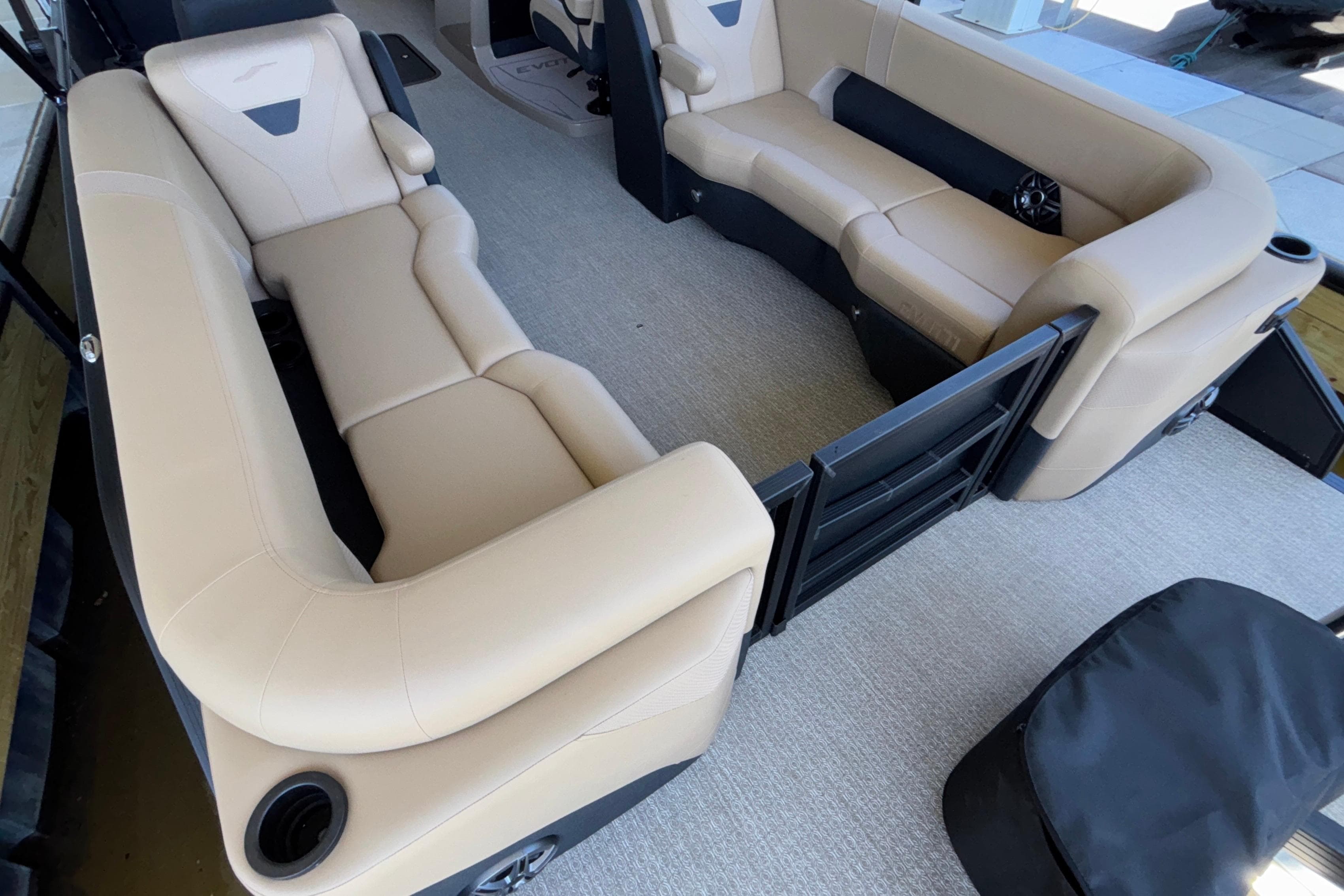 Luxurious seating in the 2026 Evotti 525QL boat, featuring beige upholstery and modern design.