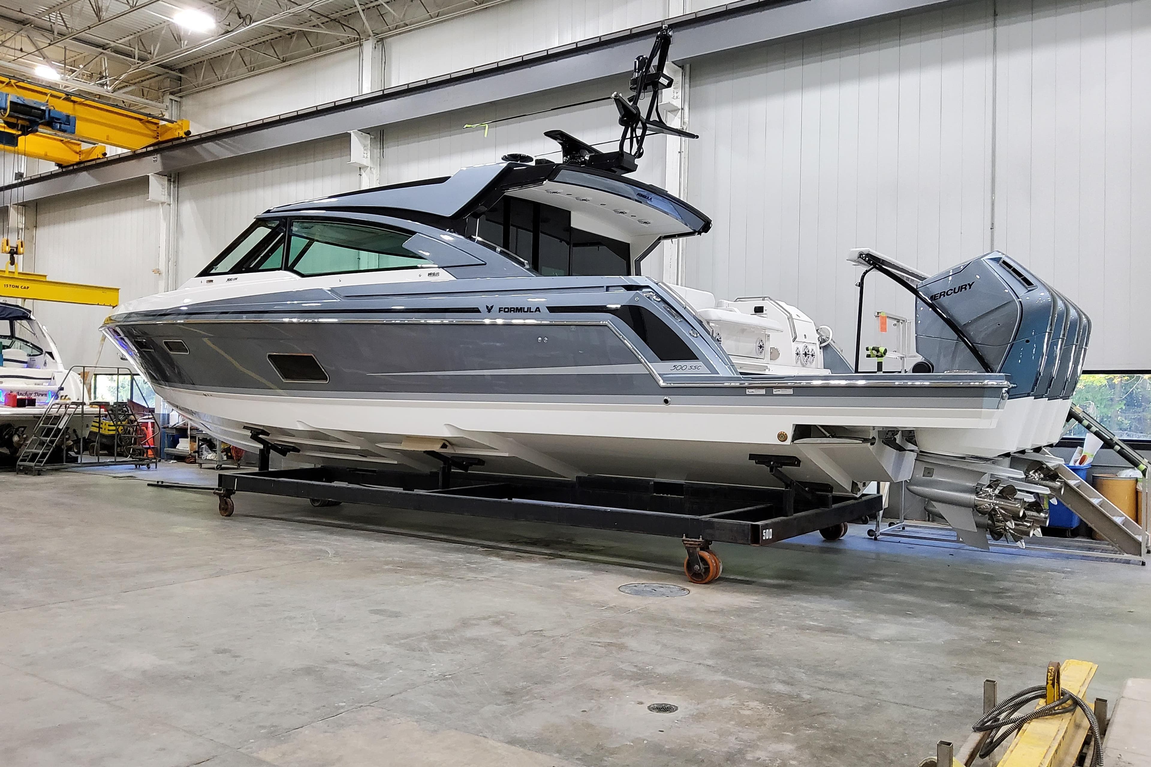 2026 Formula 500 Super Sport Crossover boat in a warehouse setting.