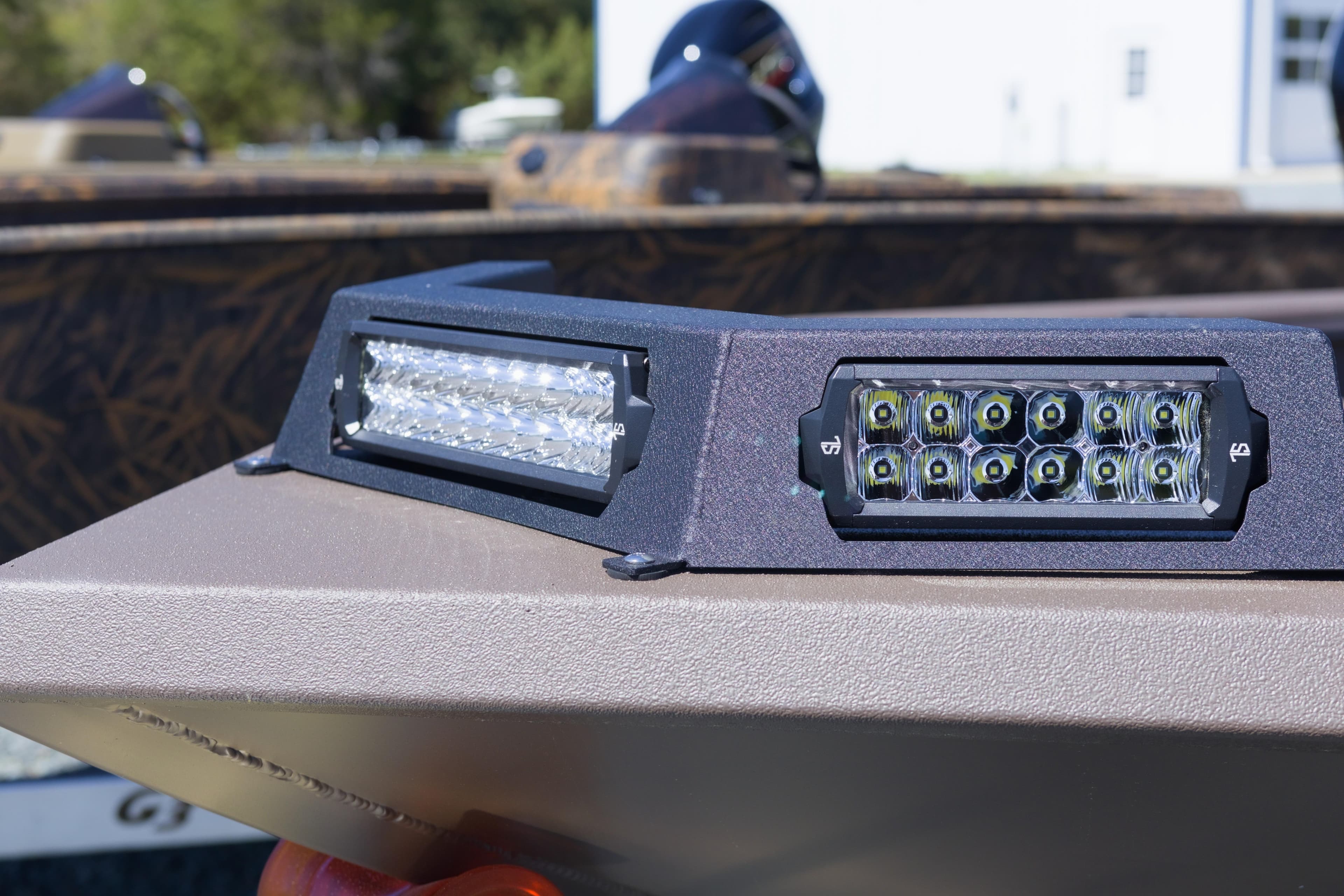 Close-up of LED lights on a 2026 Avid 18 Commander boat.