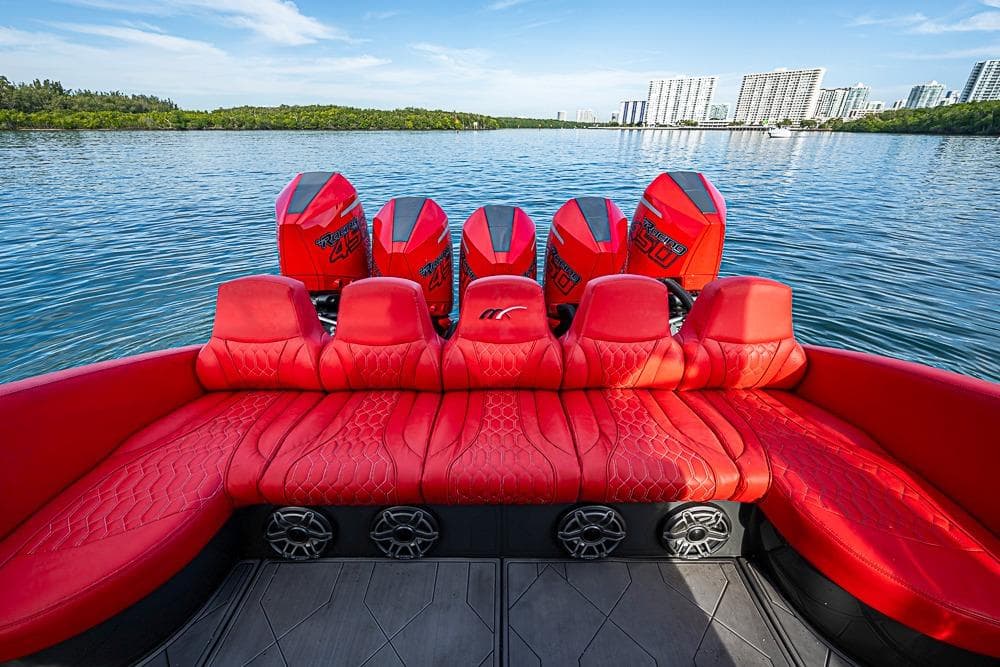 Red leather seating on 2021 Midnight Express 43 Solstice boat with powerful outboard engines.