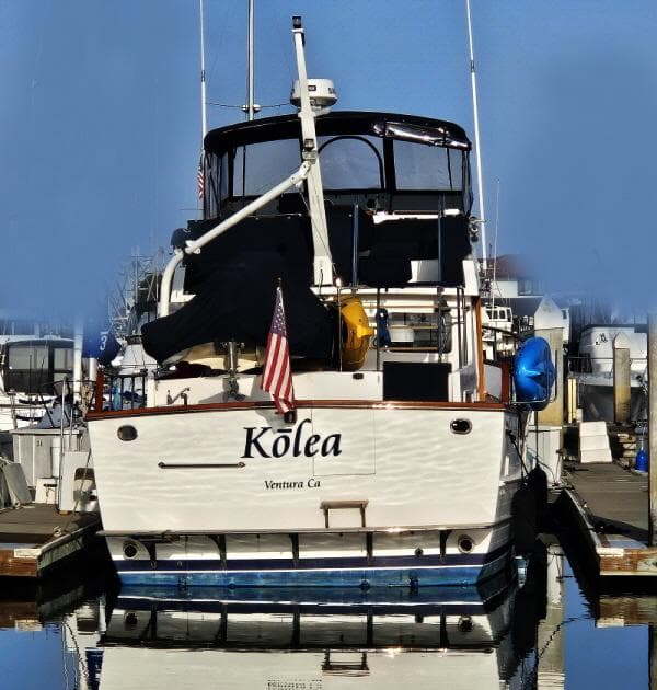 1983 Ocean Alexander 43 yacht docked, named "Kōlea," with American flag, Ventura, CA.