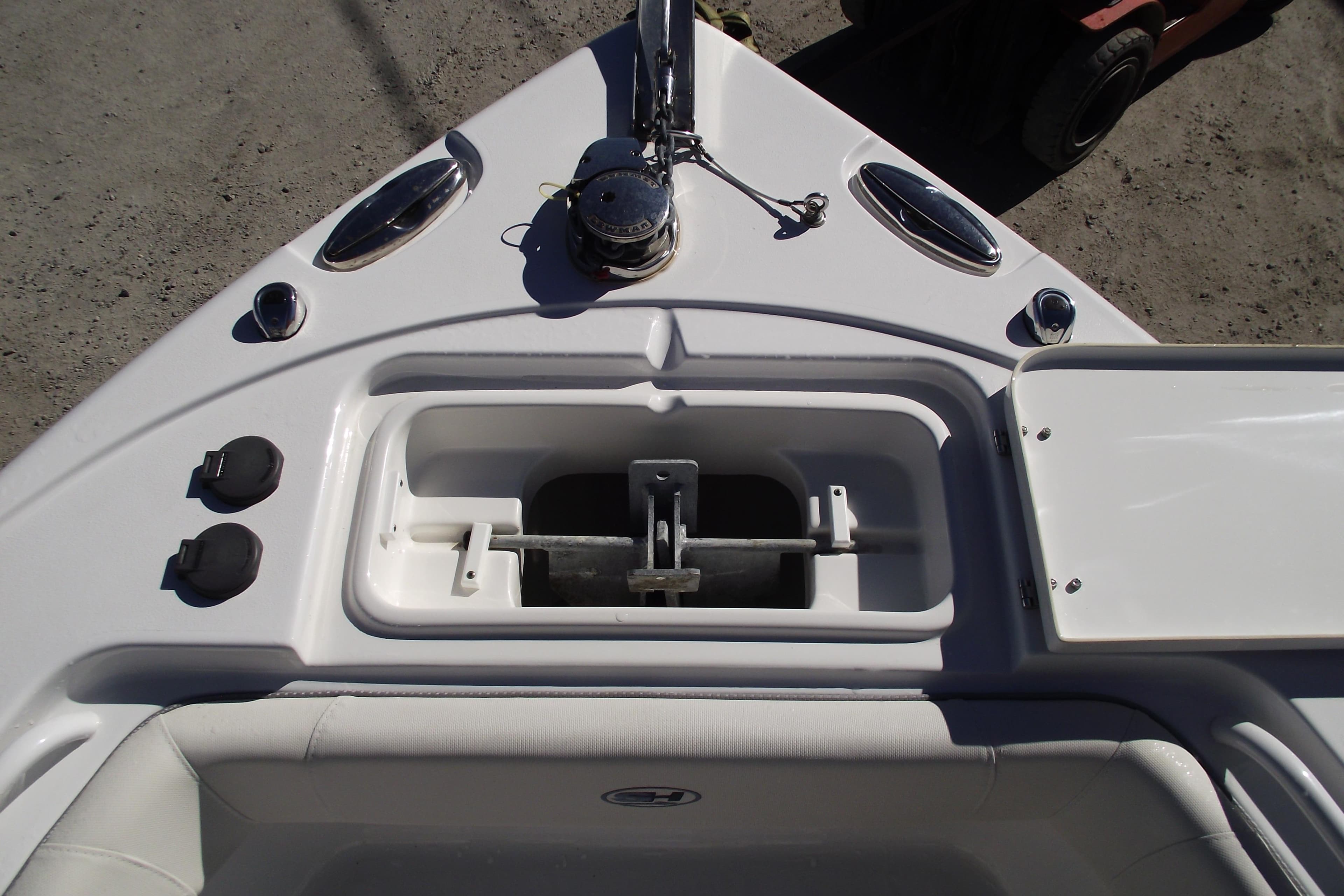2023 Sea Hunt Ultra 255 SE boat anchor compartment and deck features.
