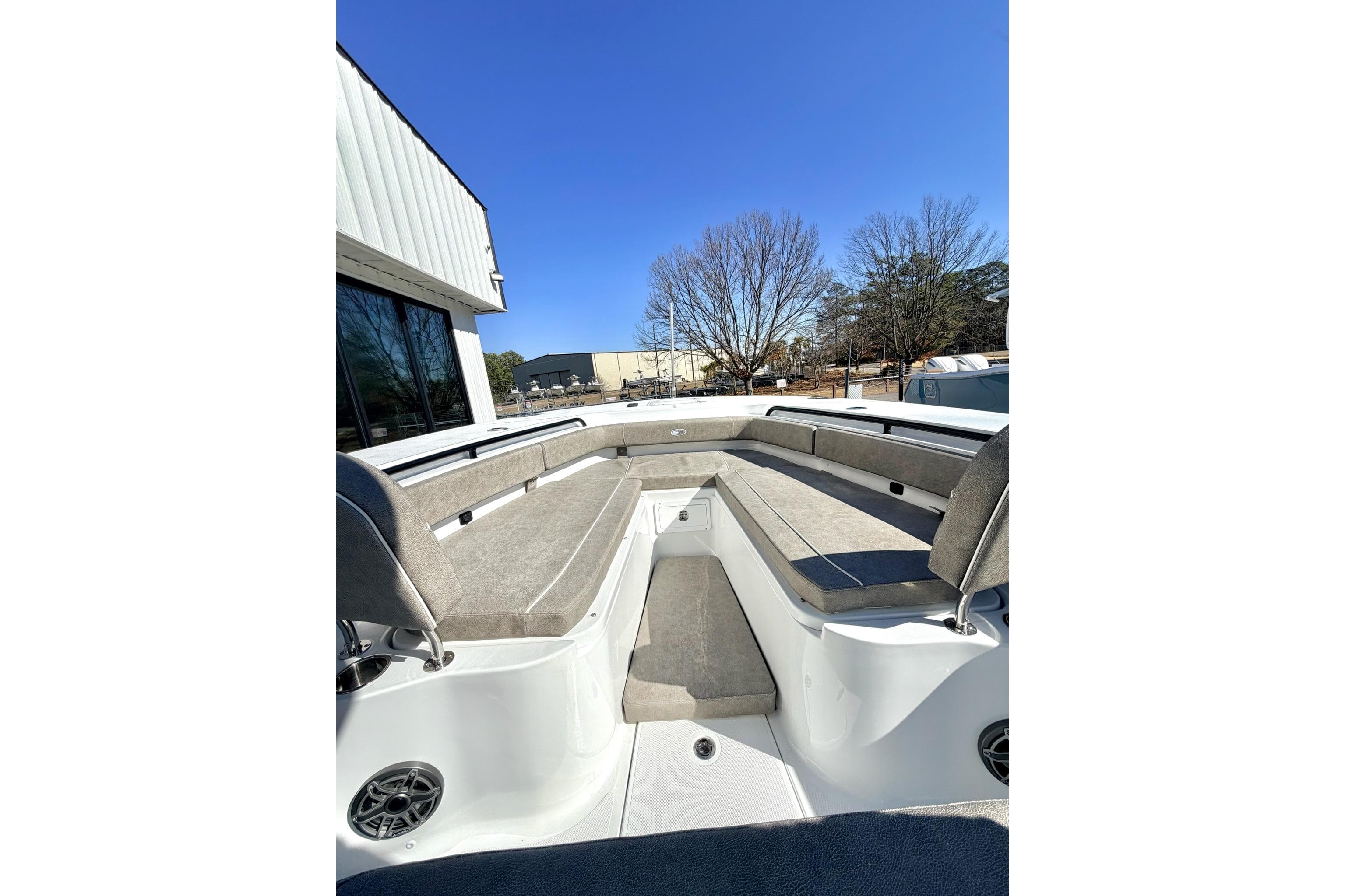 2026 Sea Hunt Ultra 285 SE boat interior with spacious seating under clear blue sky.