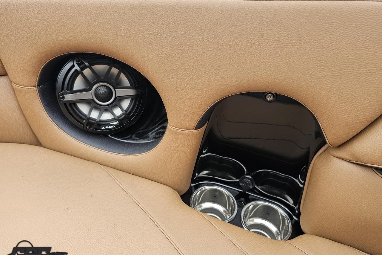 2022 Supra SE 550 interior with speaker and cup holders in tan leather.