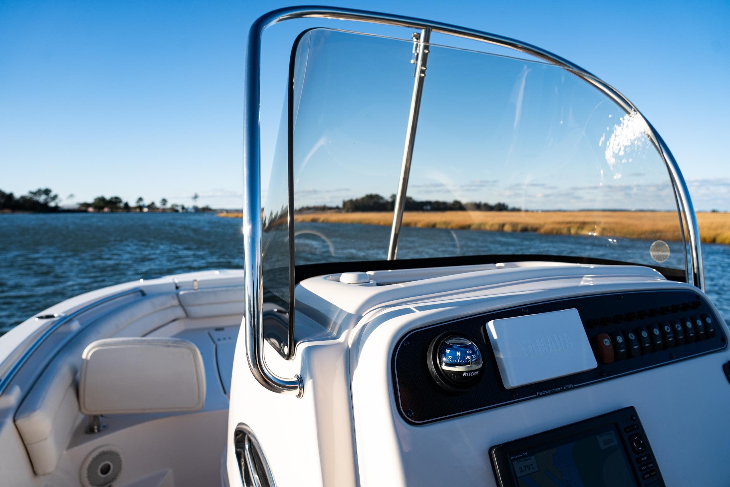 2018 Grady-White Fisherman 236 boat on water, clear sky, scenic view.