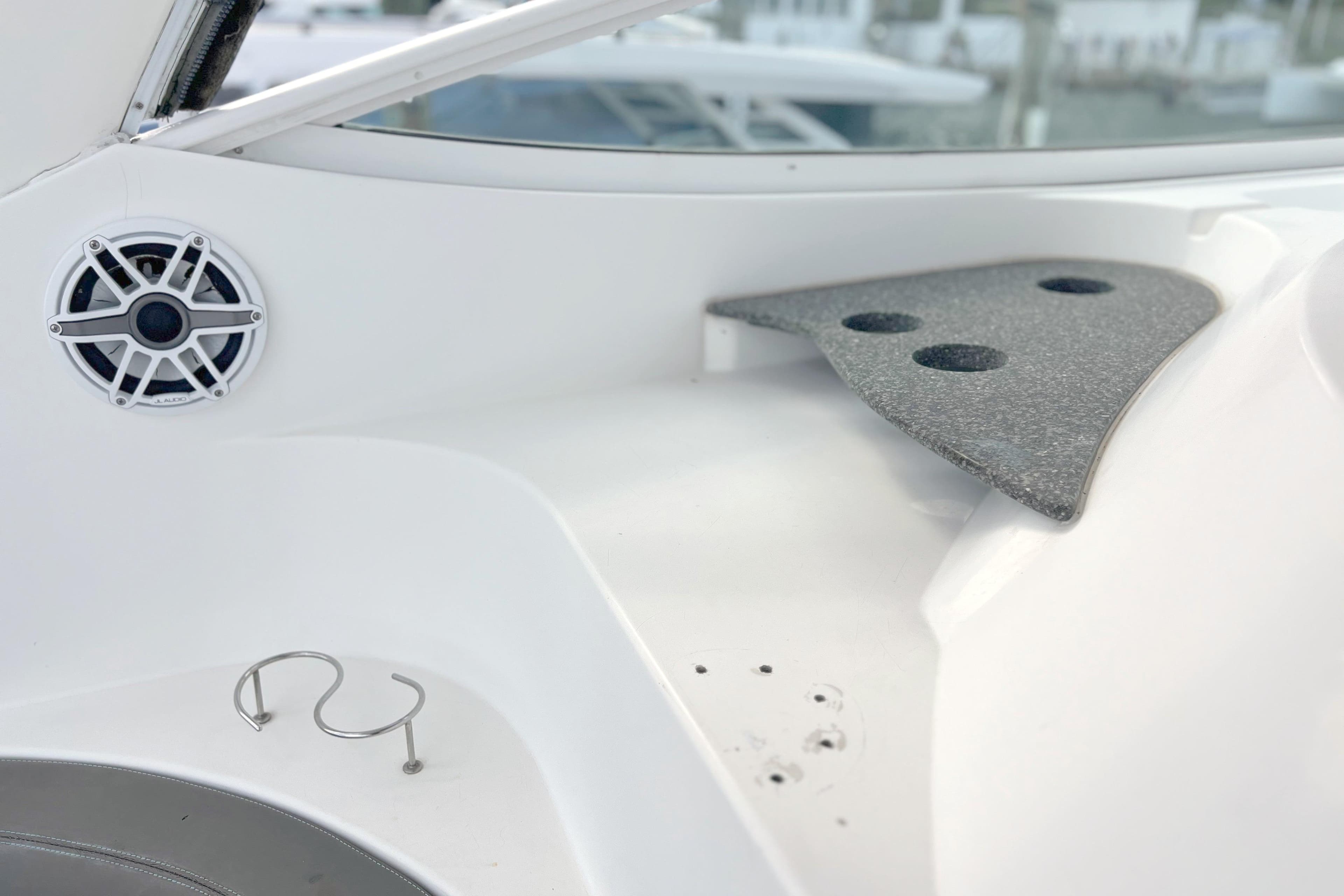 2005 Cruisers Yachts 440 Express interior with speaker and cup holder.