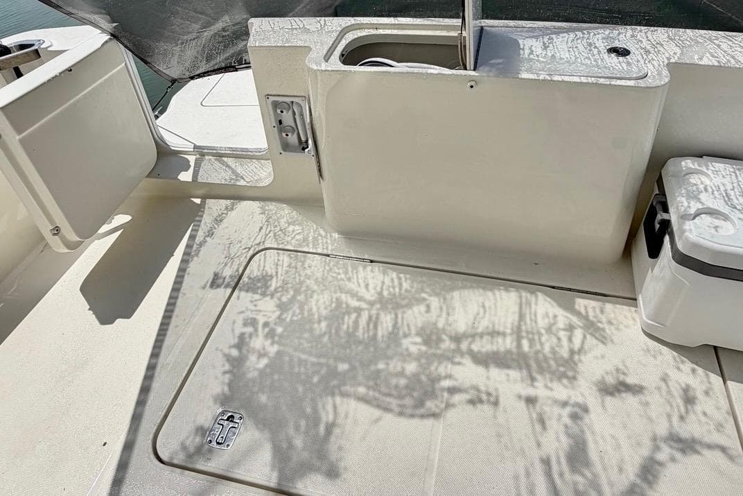 2007 Silverton 36 Convertible boat deck with storage compartments and cooler.