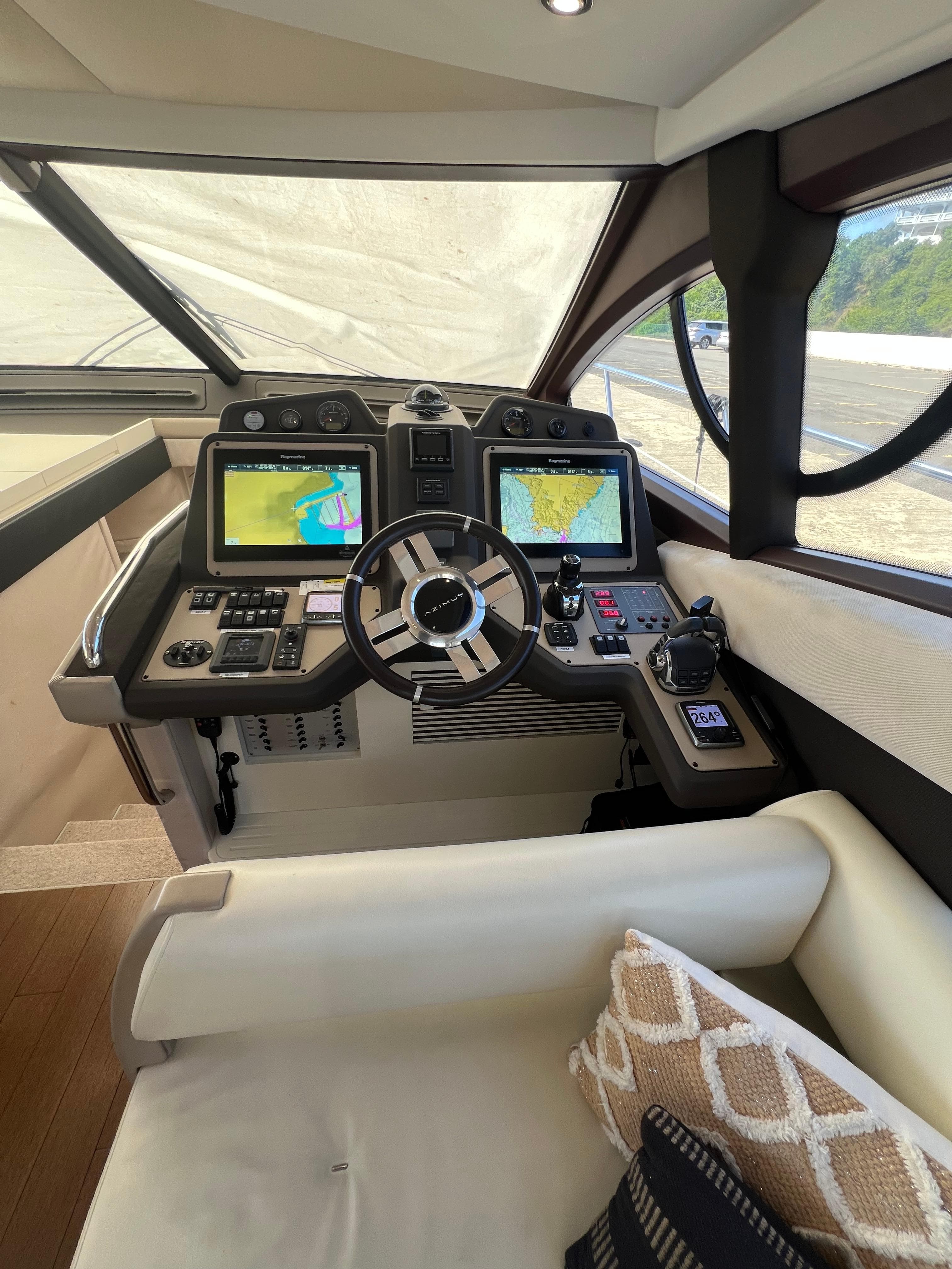 2016 Azimut 54fly yacht cockpit with modern navigation systems and luxurious seating.