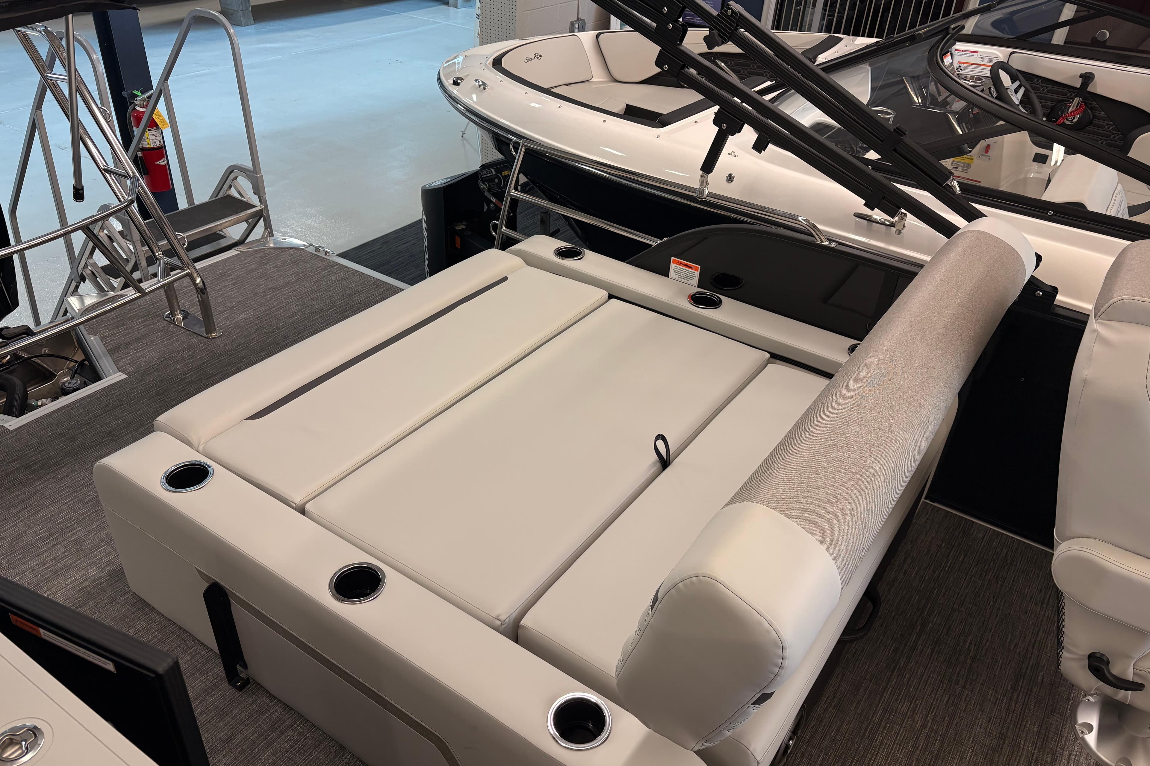 2026 Crest Conquest 250 SLSC boat interior with plush seating and cup holders.