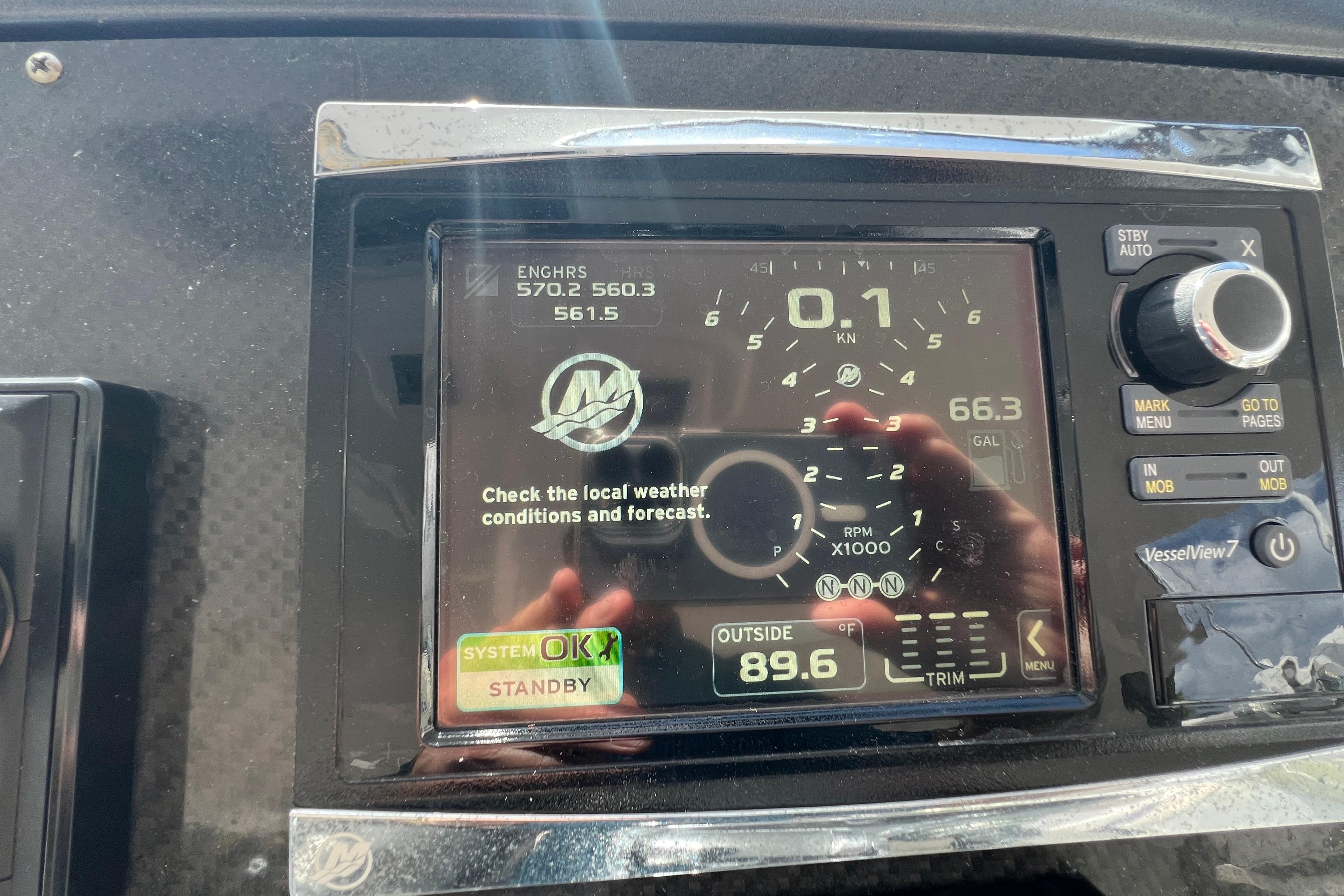 Close-up of Azimut Verve 40's 2018 dashboard display showing engine hours and weather alert.
