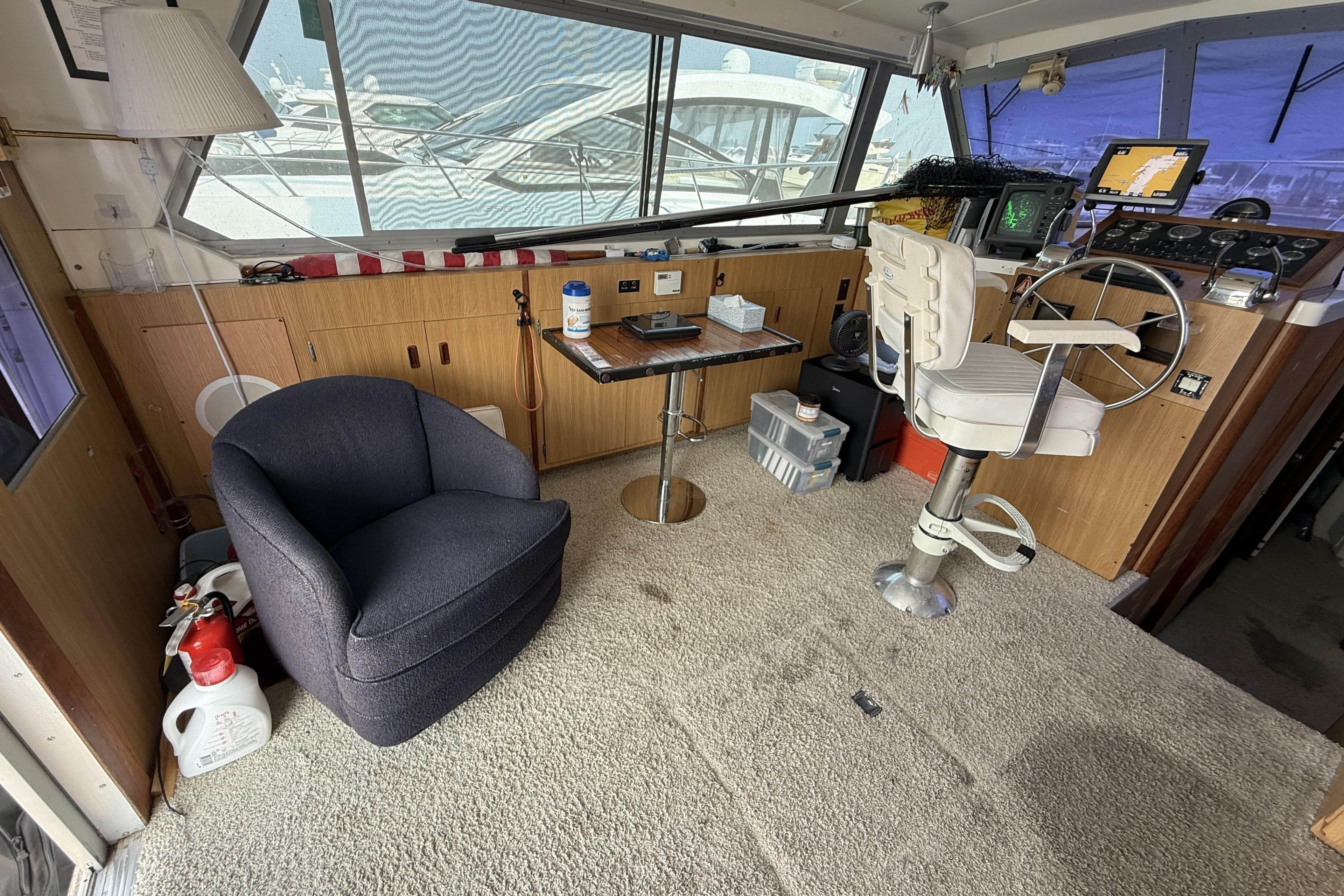 Interior of a 1978 Bertram 42 Convertible boat with helm and seating area.