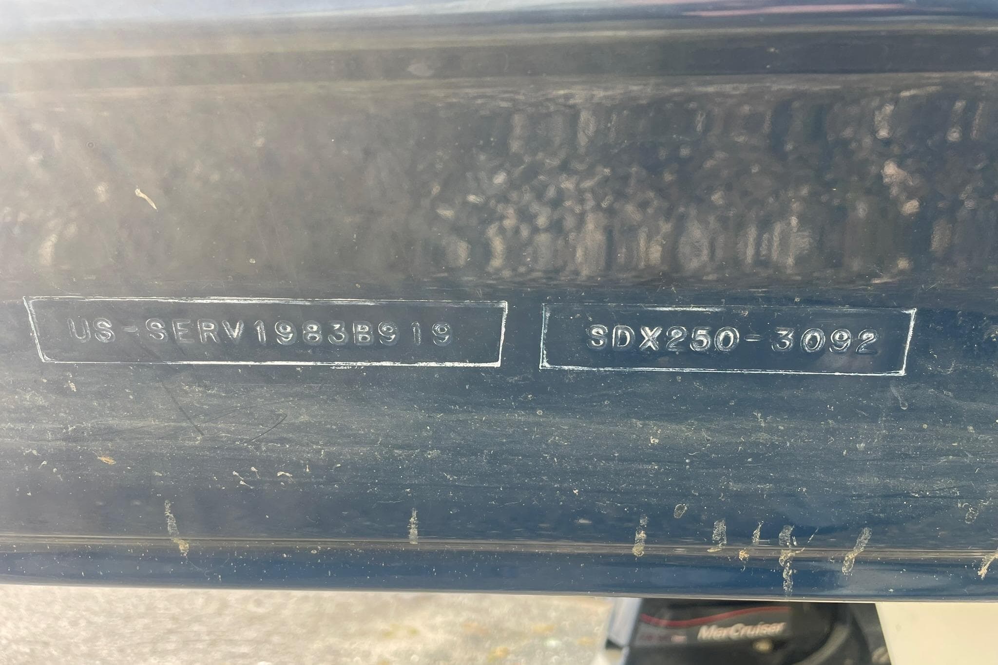 2019 Sea Ray SDX 250 hull identification number on dark surface.