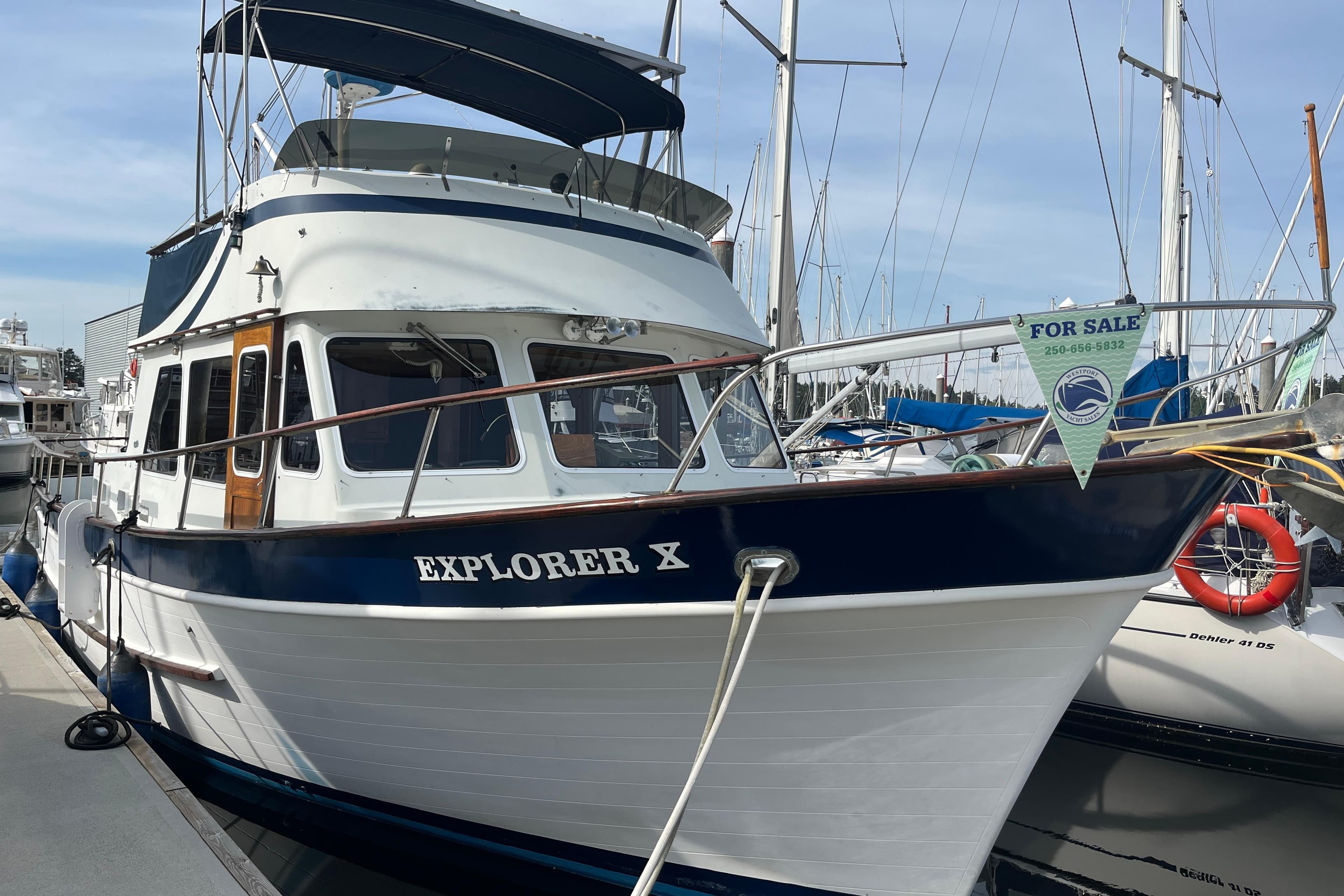 1974 DeFever 40 yacht "Explorer X" docked, available for sale, featuring classic design.