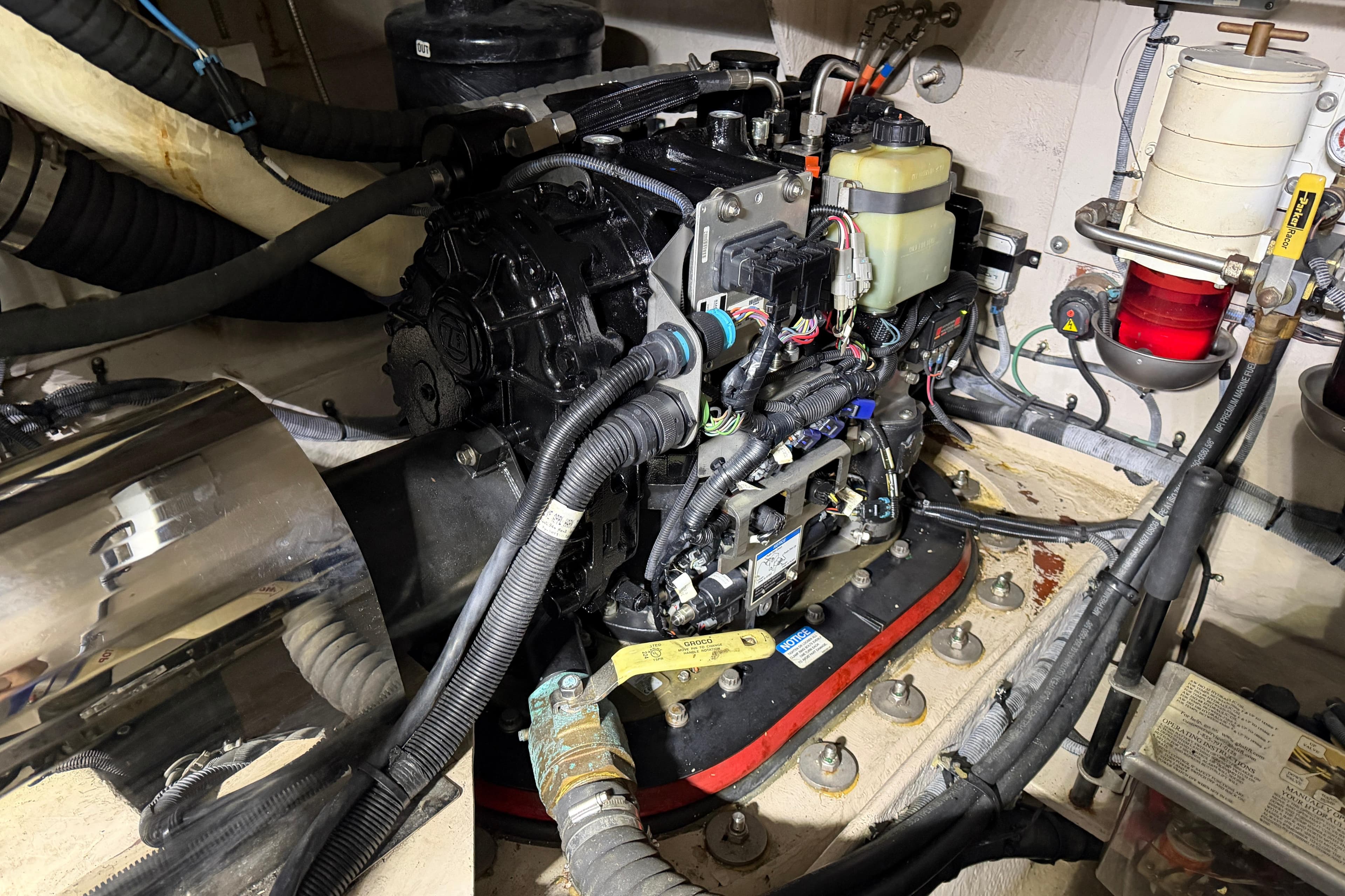 Engine compartment of a 2014 Sea Ray 540 Sundancer with visible wiring and components.