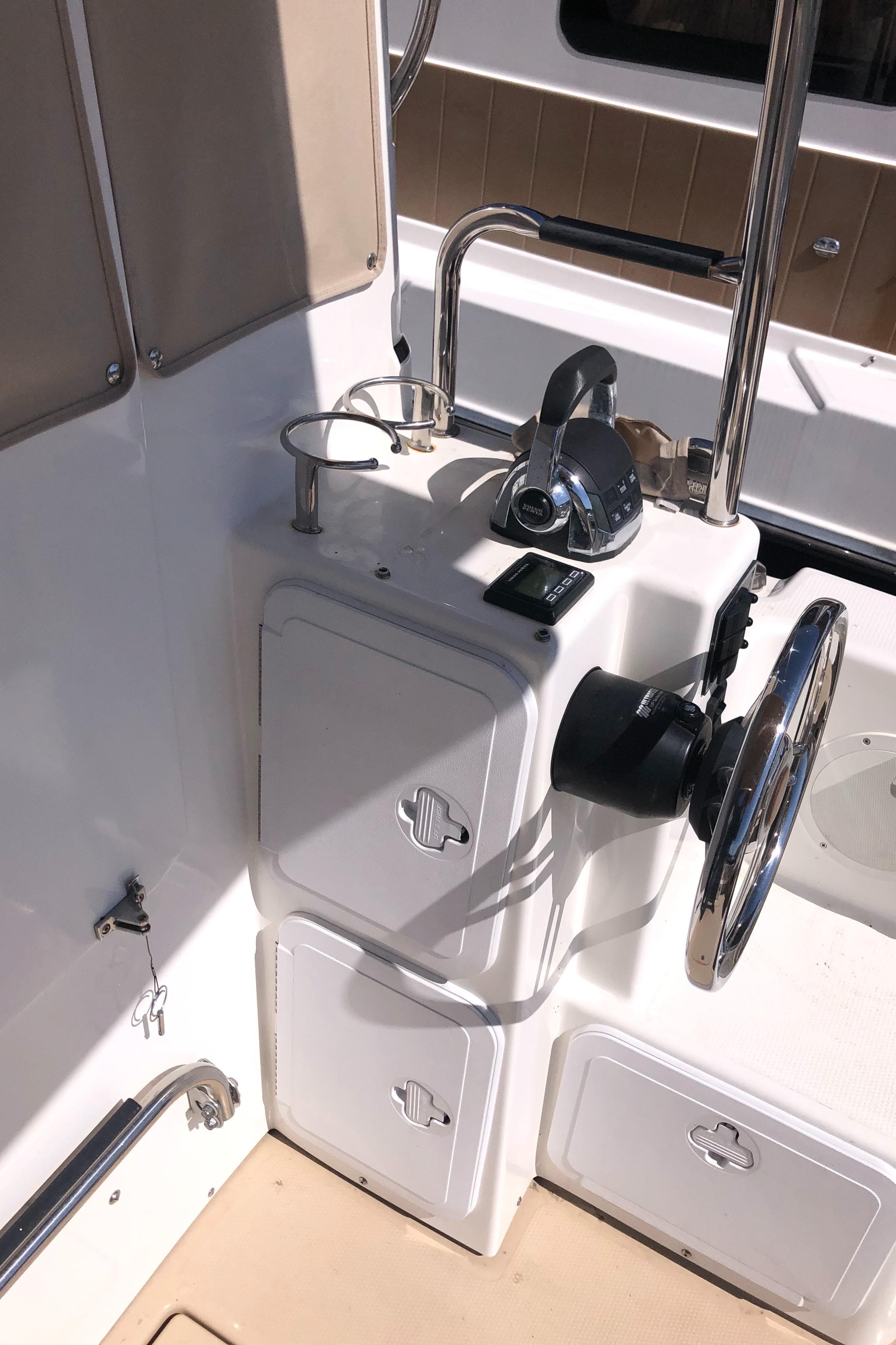 2016 Cutwater 30 Command Bridge helm with steering wheel and controls.