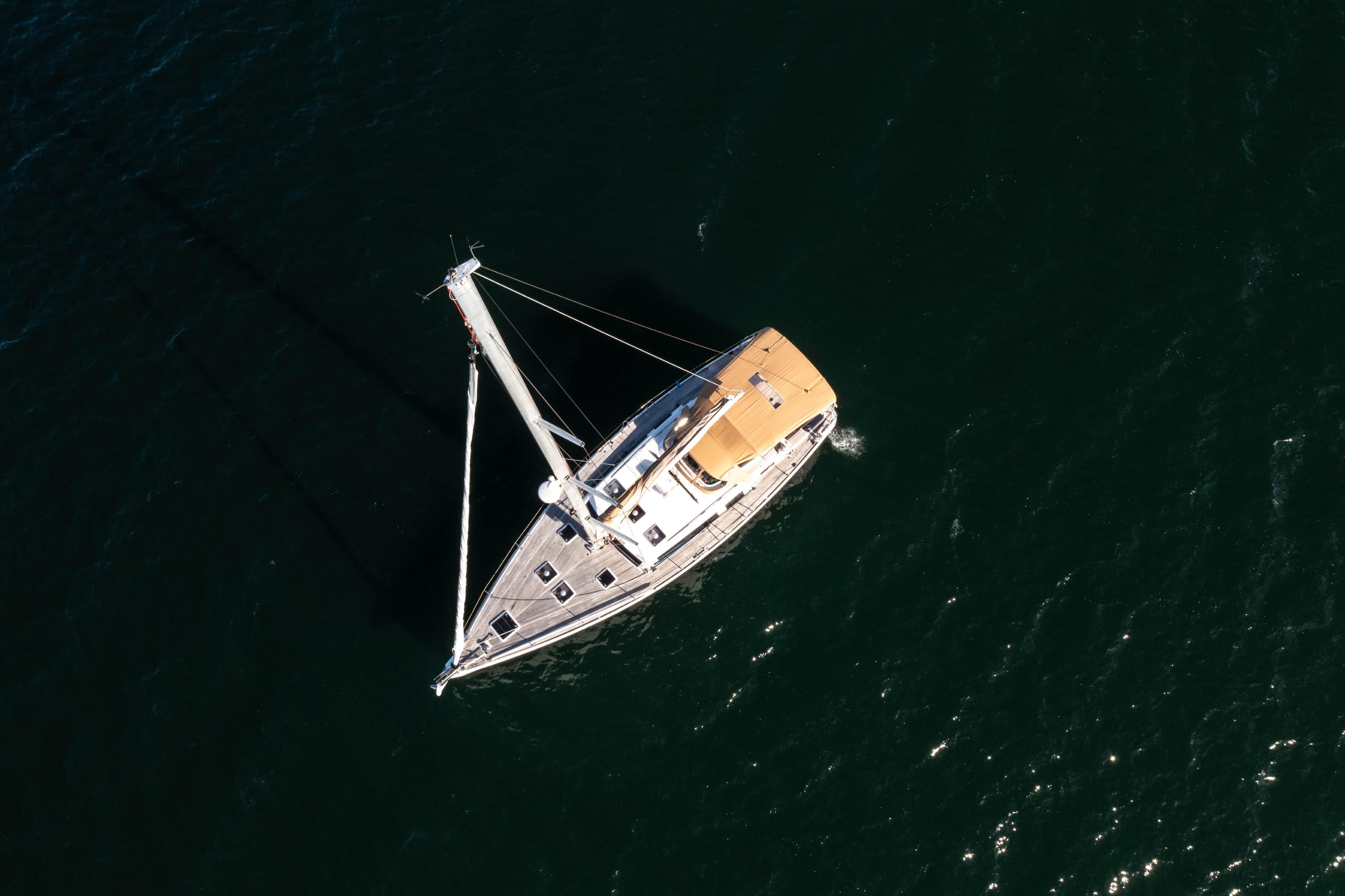 Aerial view of 2011 Dufour 525 Grand Large sailing on open water.