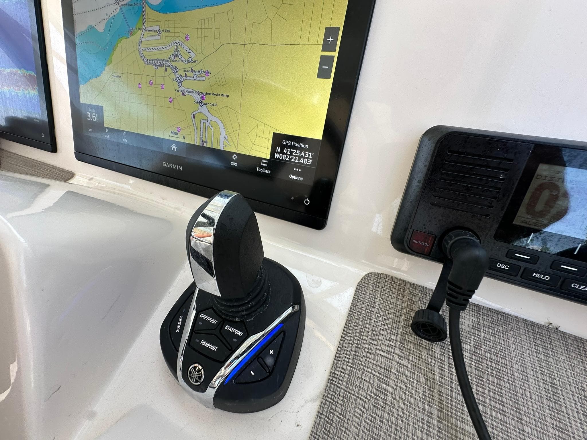 2024 Grady-White Freedom 335 boat dashboard with Garmin navigation and joystick controls.