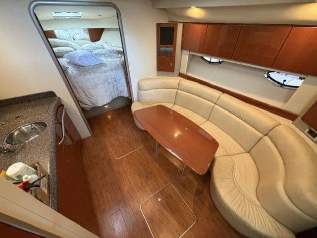 Interior of a 2009 Formula 37 Performance Cruiser with leather sofa and kitchenette.