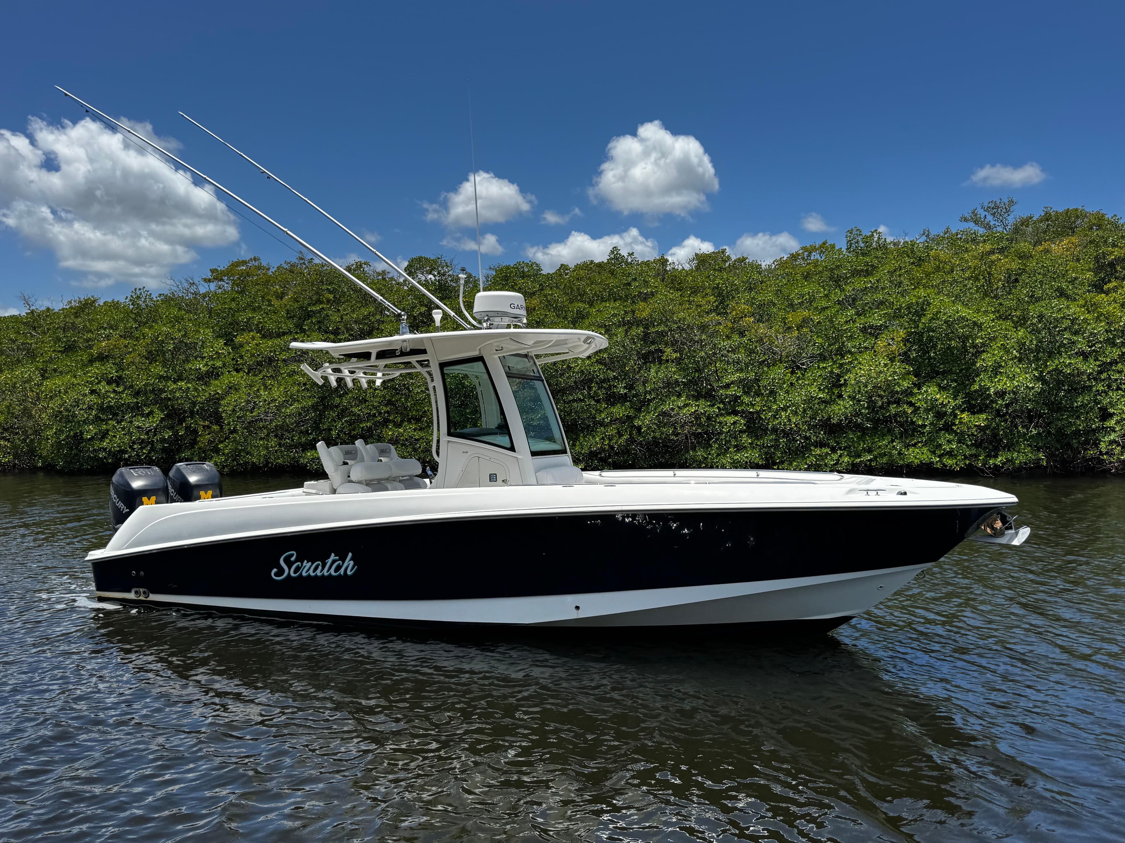 2011 Boston Whaler 280 Outrage boat on calm water.