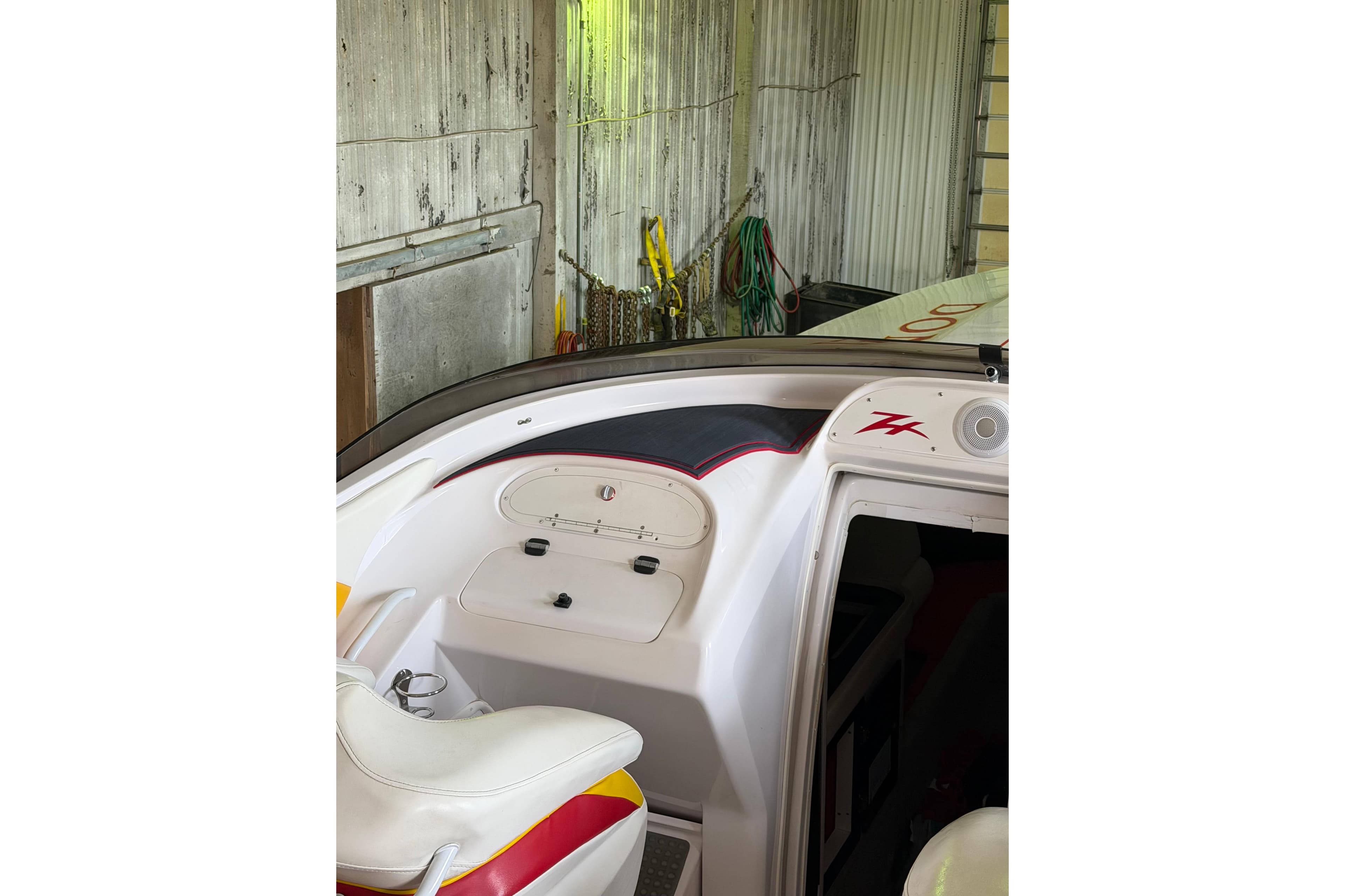 Interior view of a 2002 Donzi 38 ZX boat in a garage setting.