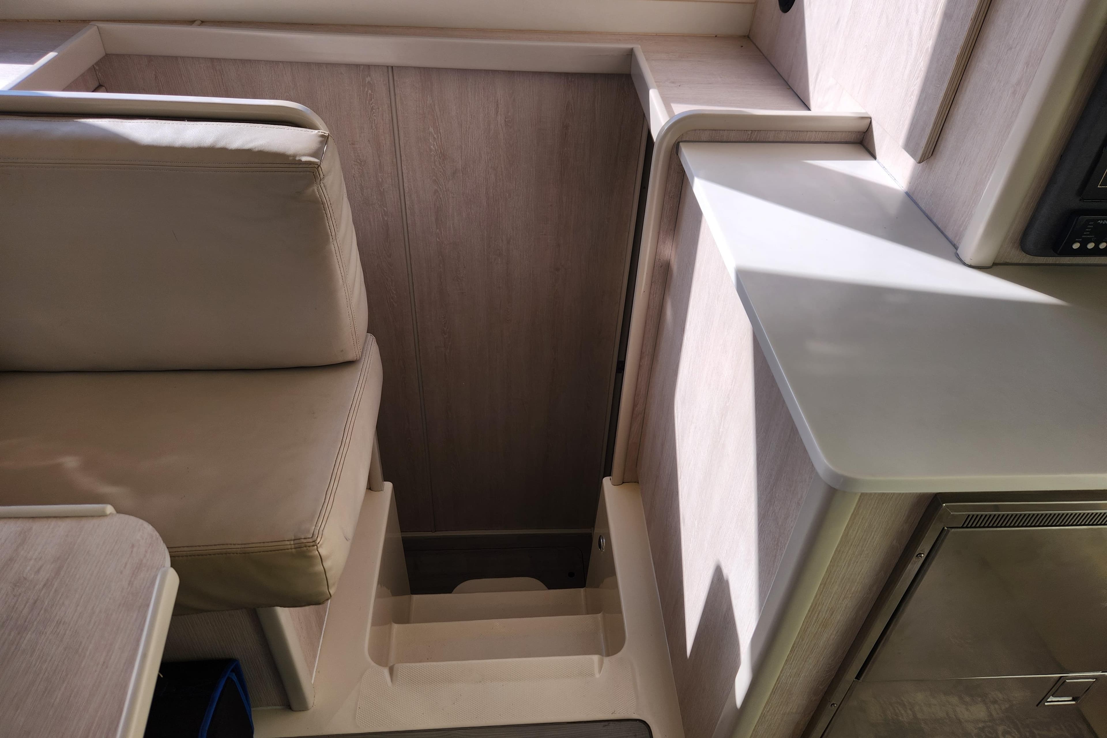 Interior of a 2015 Leopard 44 yacht showing seating and stairs.