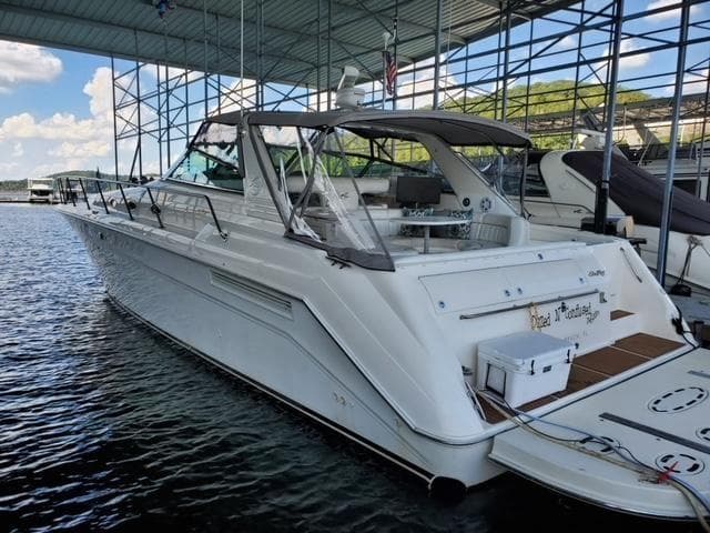 1997 Sea Ray 500 Sundancer yacht docked in a marina.