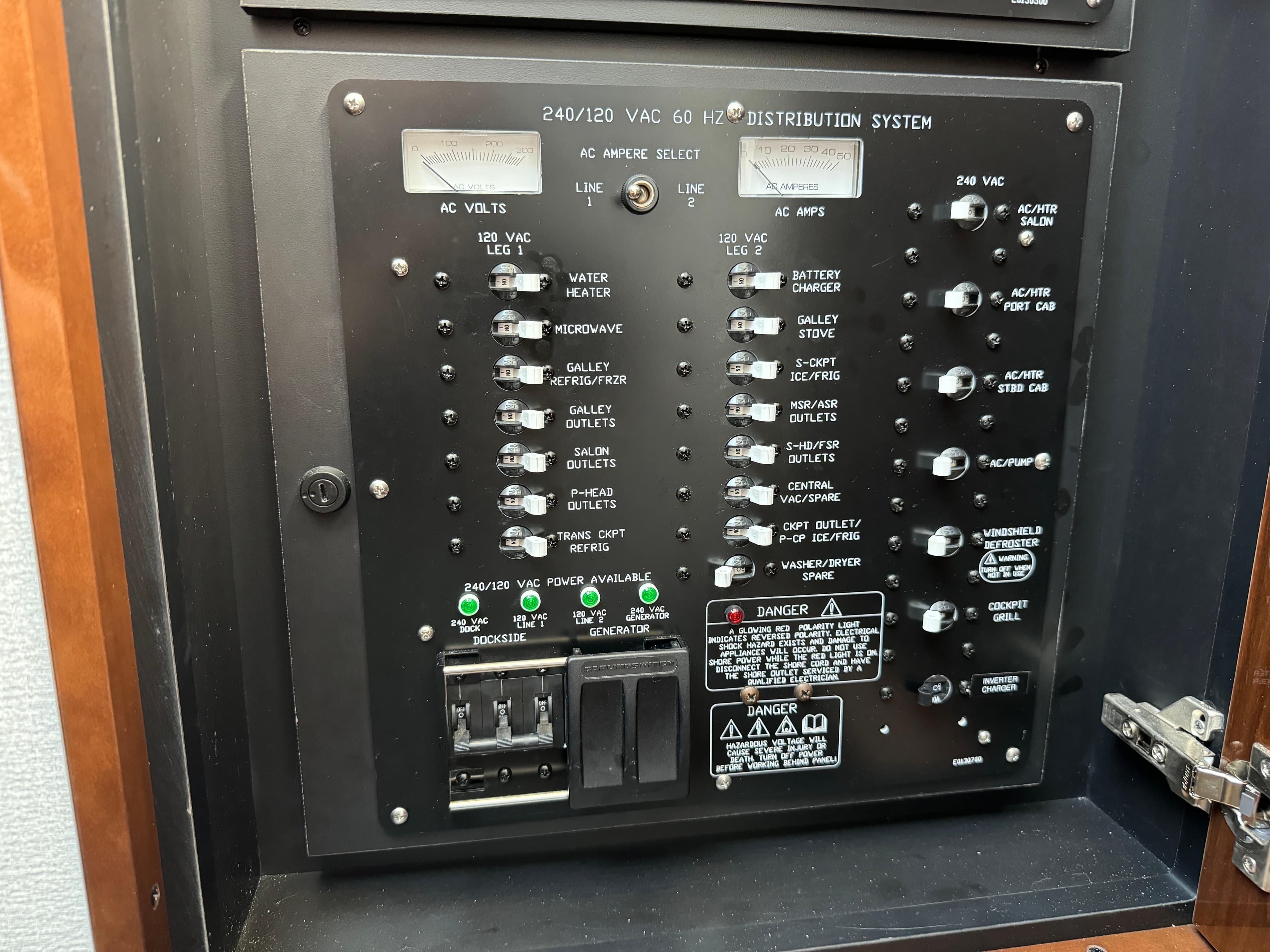 Electrical panel of 2023 Cruisers Yachts 46 Cantius, featuring AC distribution system.