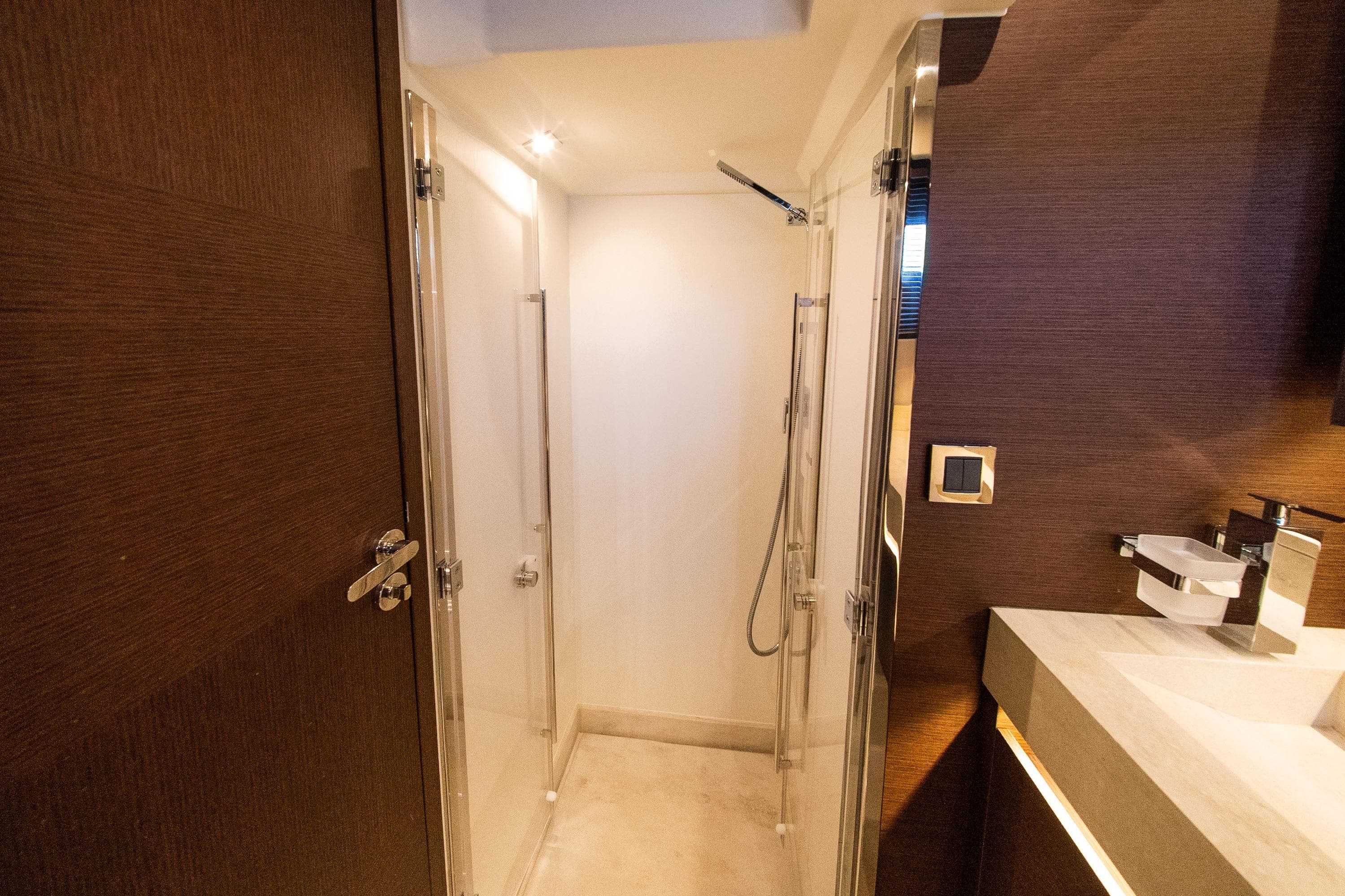 Luxurious bathroom interior of 2022 Prestige 520 yacht, featuring modern shower and sleek design.