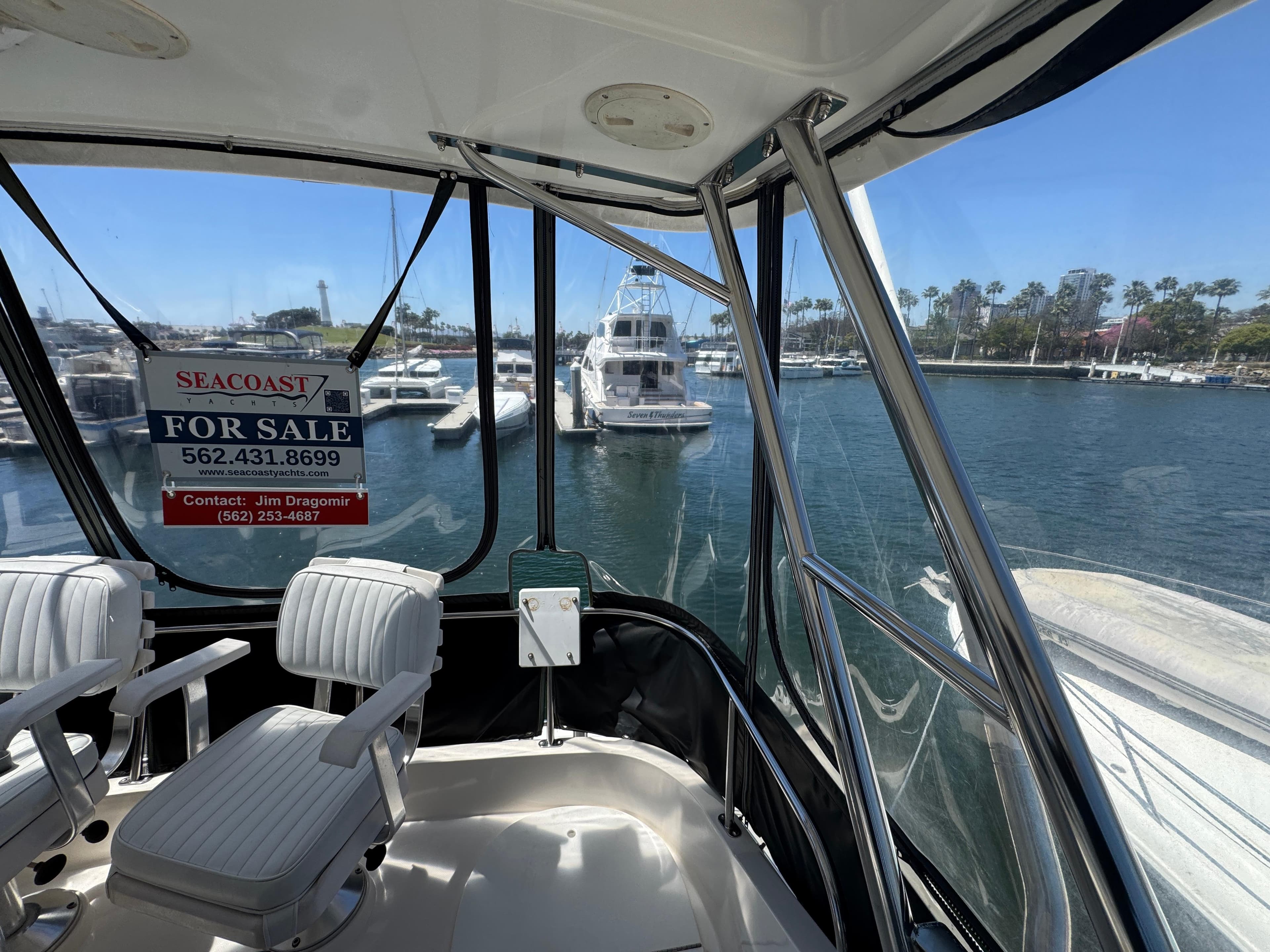 2003 Mediterranean 38 Convertible yacht for sale, docked in marina, interior view.