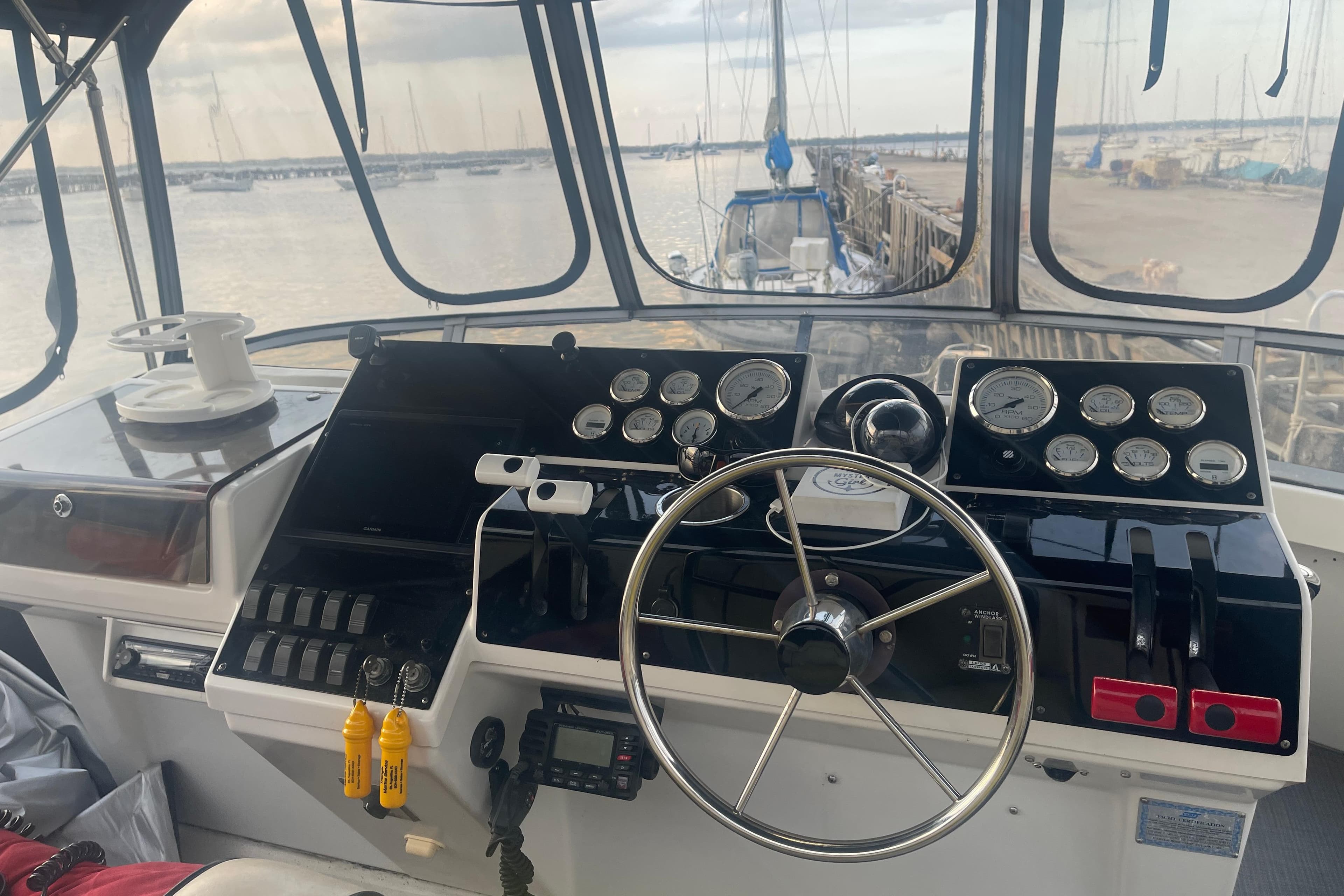 1995 Carver 350 Aft Cabin Motor Yacht helm with gauges and steering wheel.