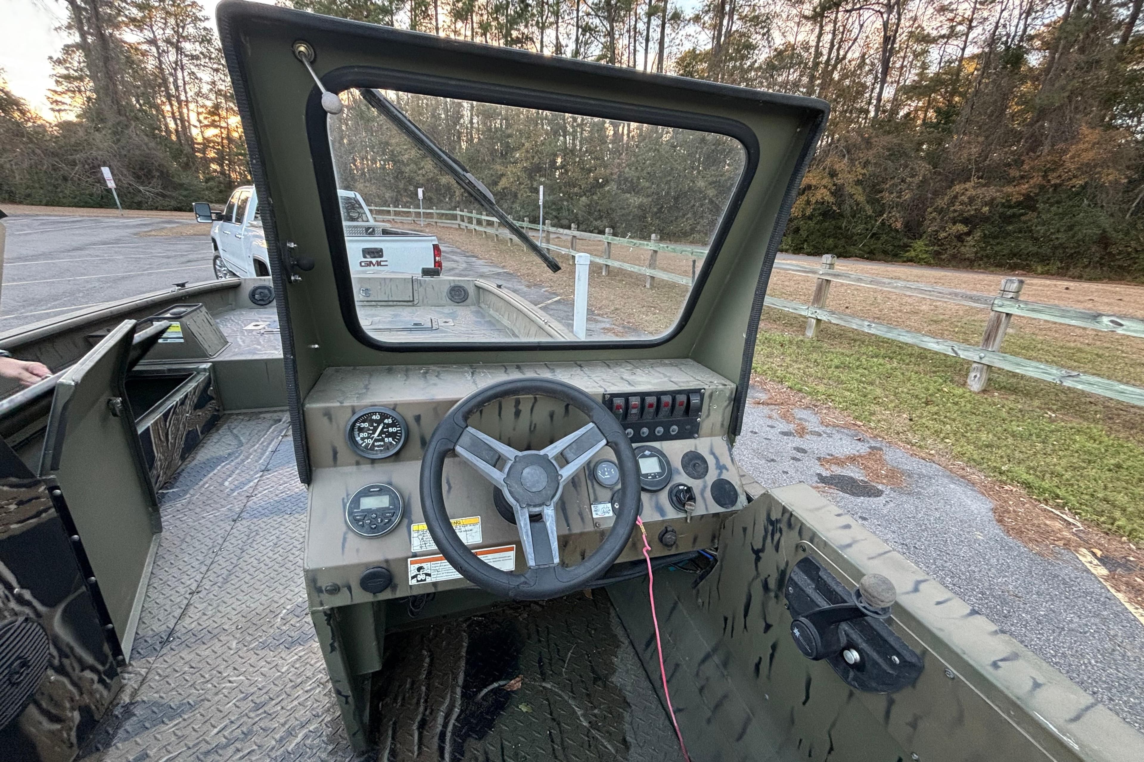 2019 SeaArk Predator 220 AK SC boat dashboard with steering wheel and controls.