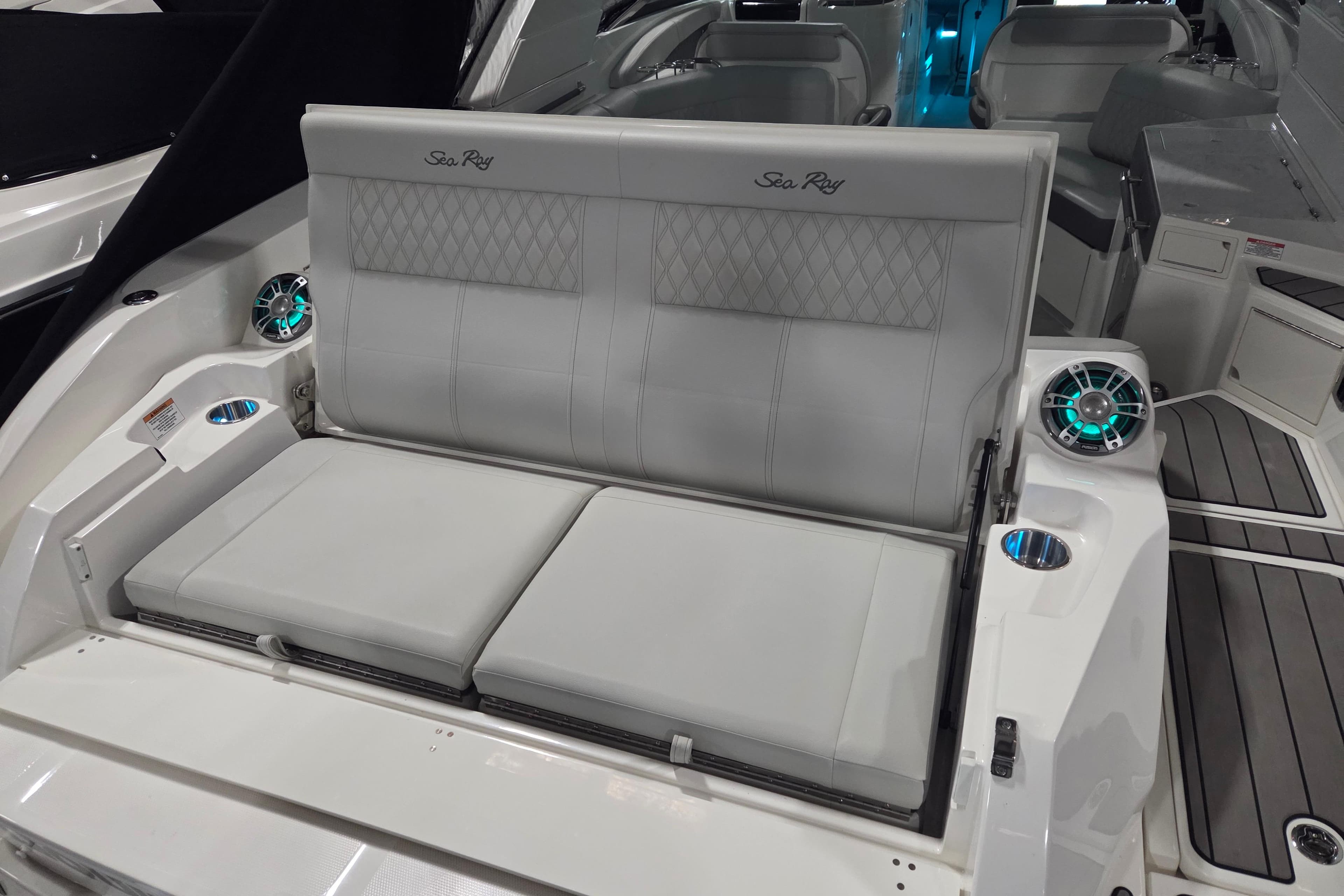 2023 Sea Ray SLX 350 boat interior with luxurious seating and modern speakers.