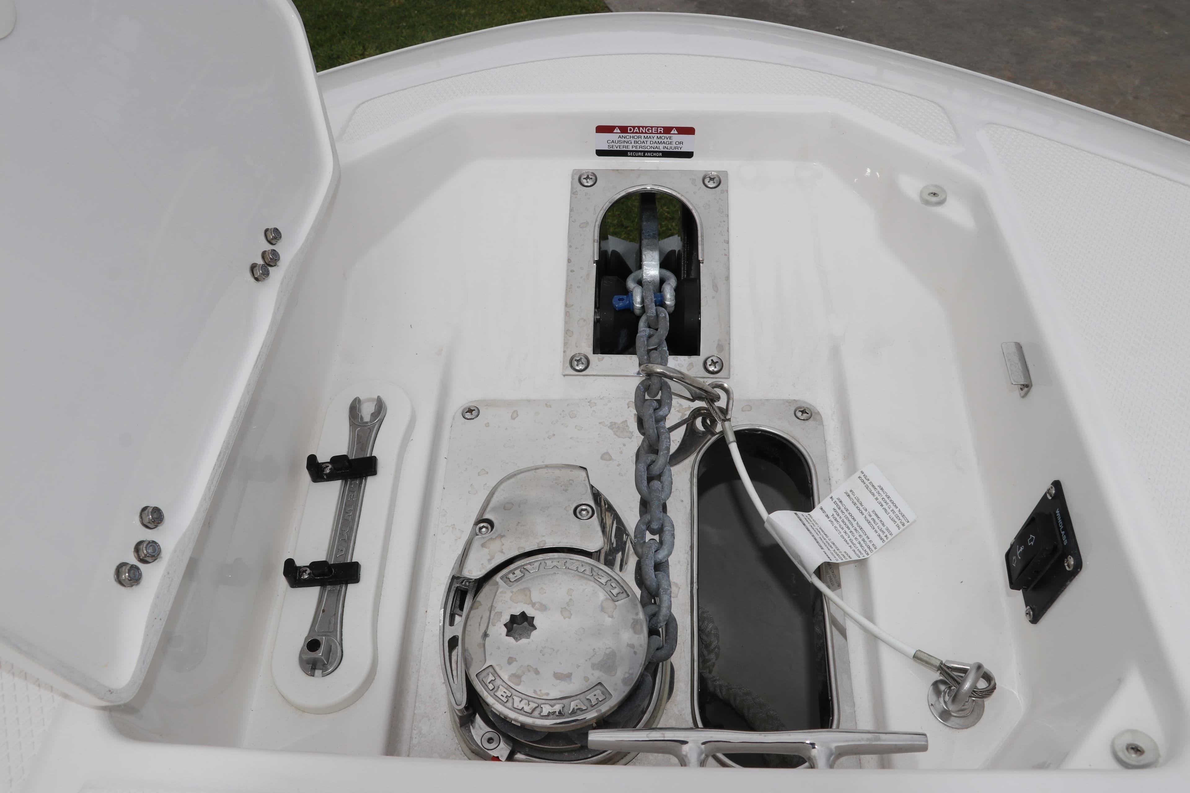 Anchor compartment of 2026 Robalo R257 Dual Console boat, featuring chain and winch.