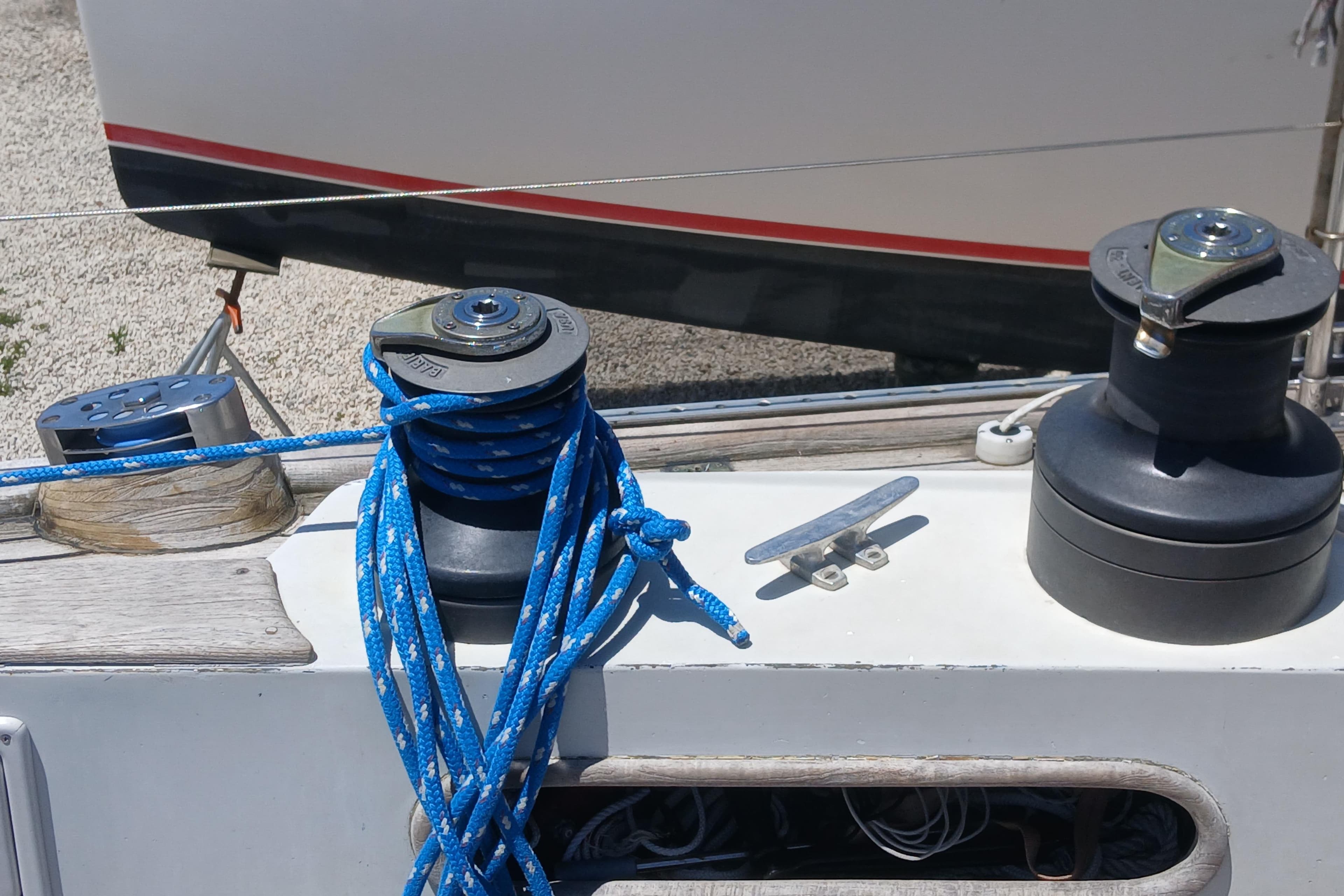 Deck of 1981 Kaufman Skye 51 sailboat with winches and blue rope.