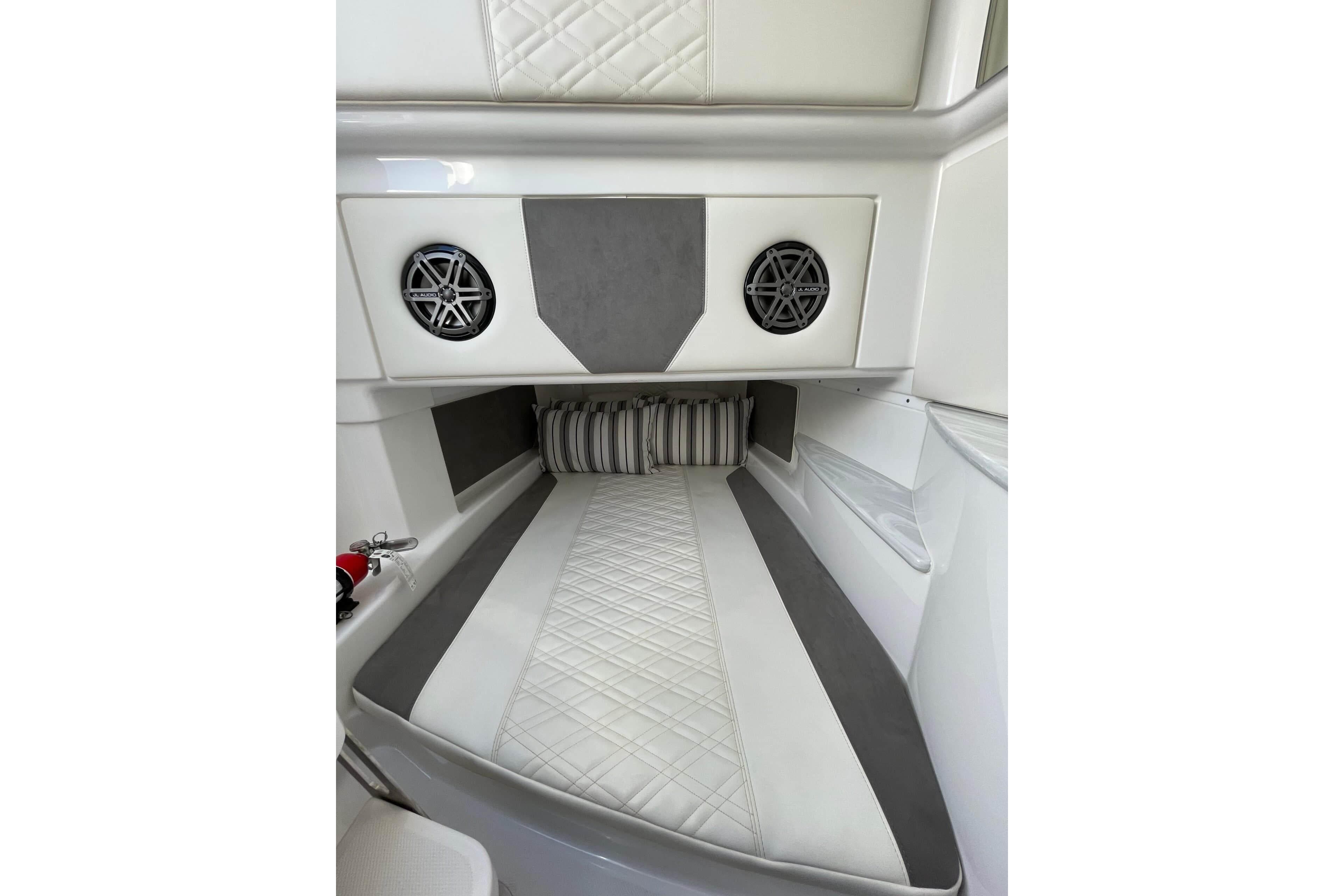 2019 Cigarette 41' GTR cabin interior with quilted upholstery and built-in speakers.