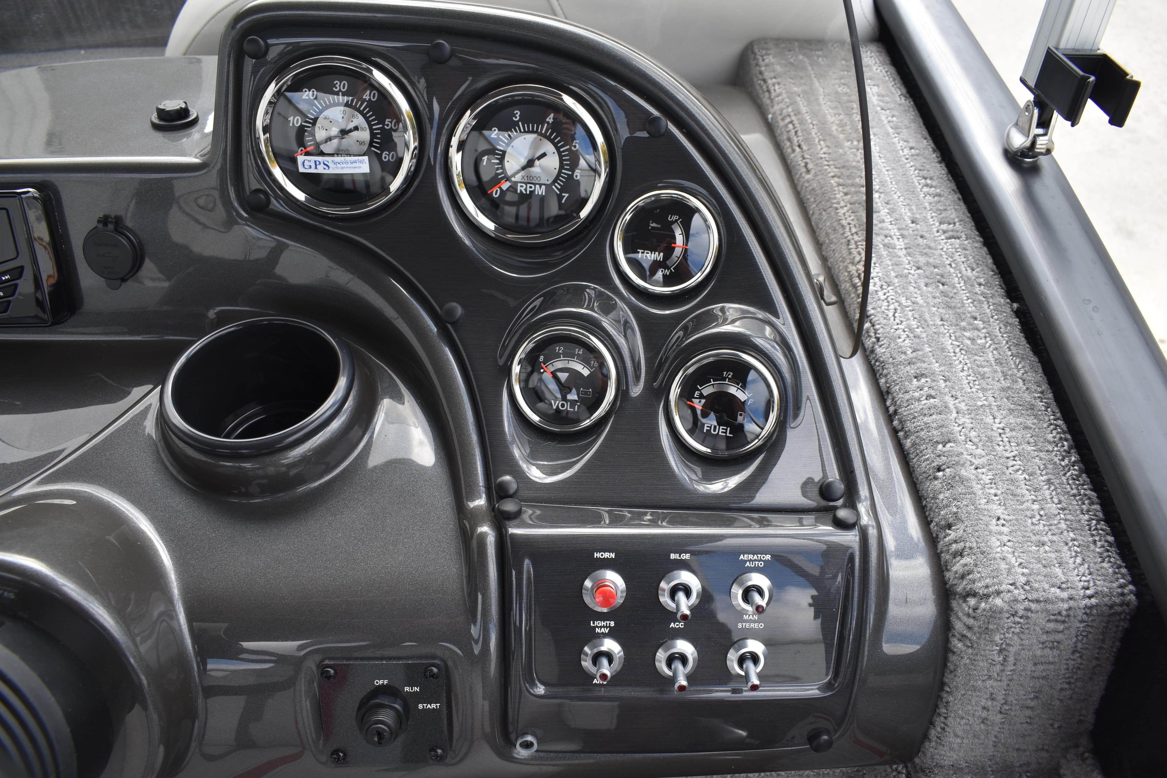Dashboard of 2026 Lowe Sport Deck 224 boat with gauges and controls.