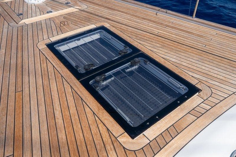 Teak deck of 2023 Hallberg-Rassy 50 yacht with dual hatches.