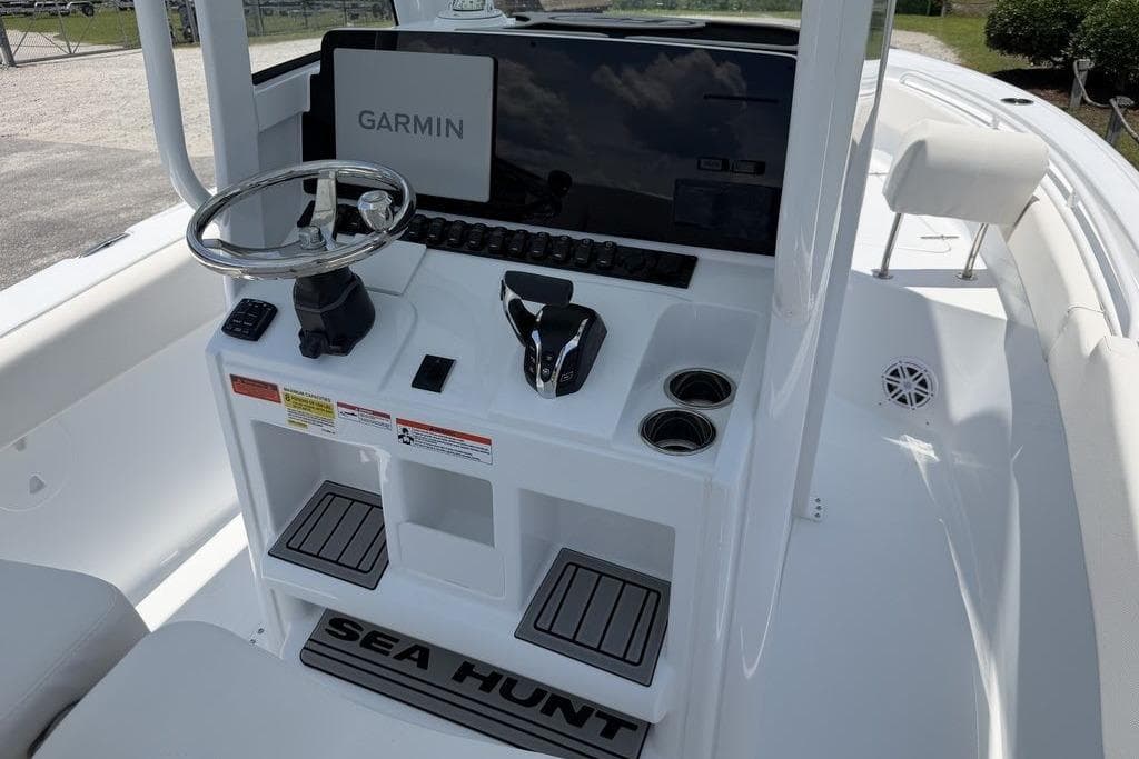2027 Sea Hunt Ultra 239 SE boat console with Garmin navigation system and steering wheel.
