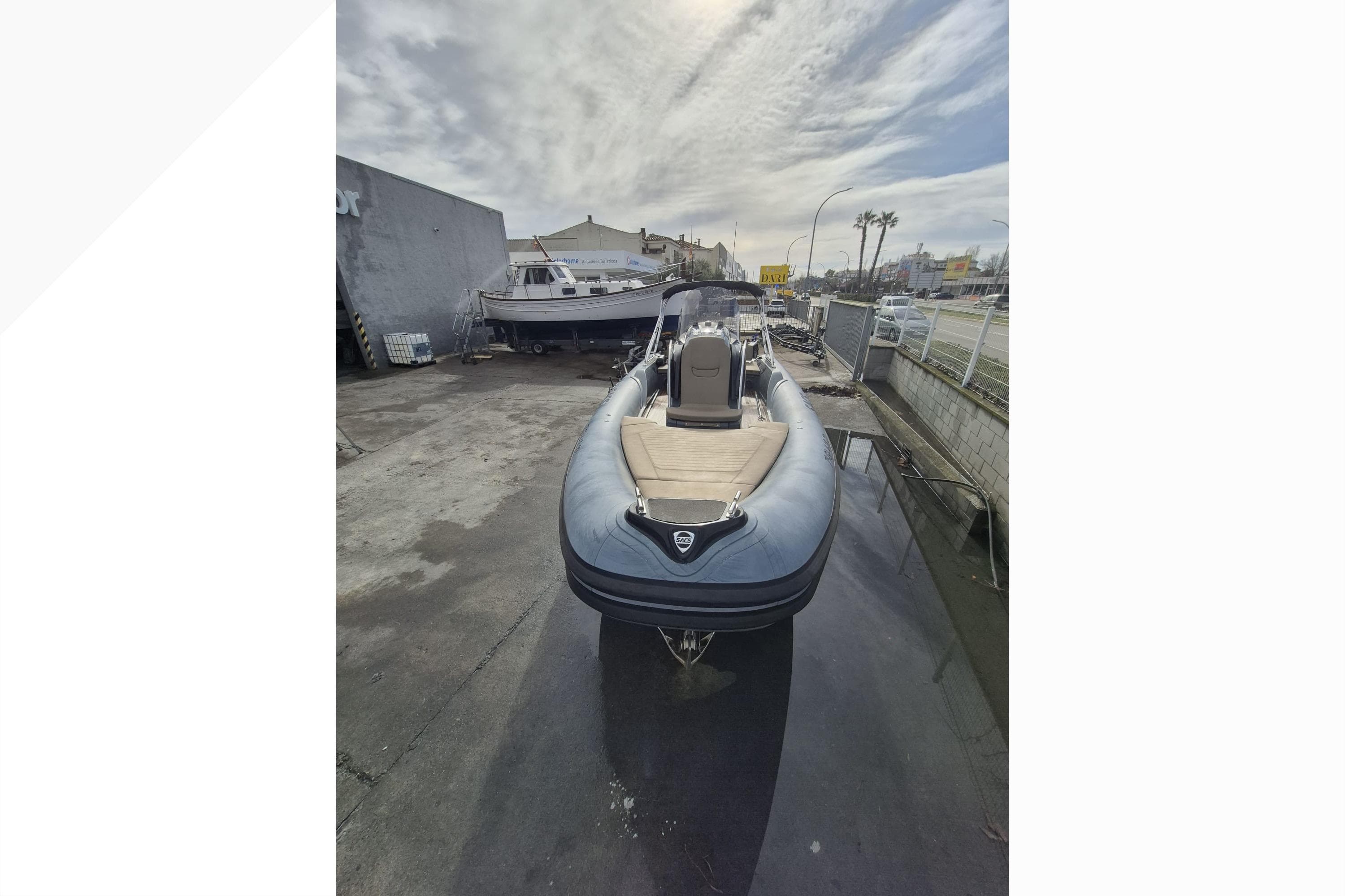 2020 SACS Strider 800 inflatable boat parked outdoors on a cloudy day.