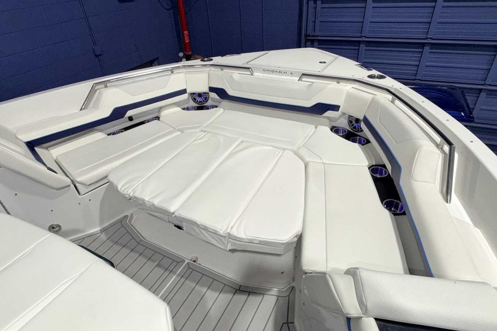 2025 Formula 387 Center Console Fish boat with luxurious white seating and modern design.