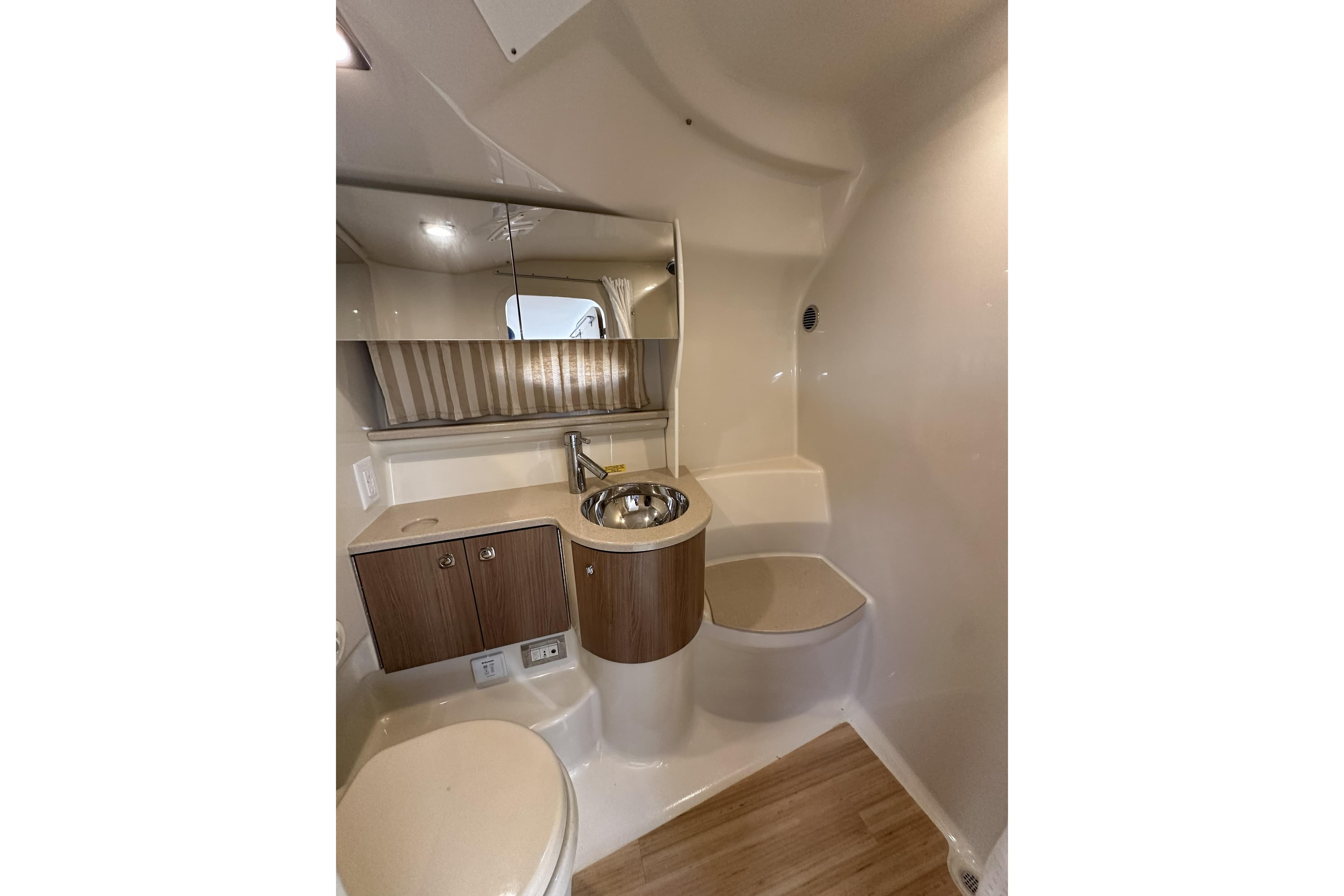 Luxurious bathroom interior of 2011 Formula Yachts 40ss with modern fixtures and wood accents.