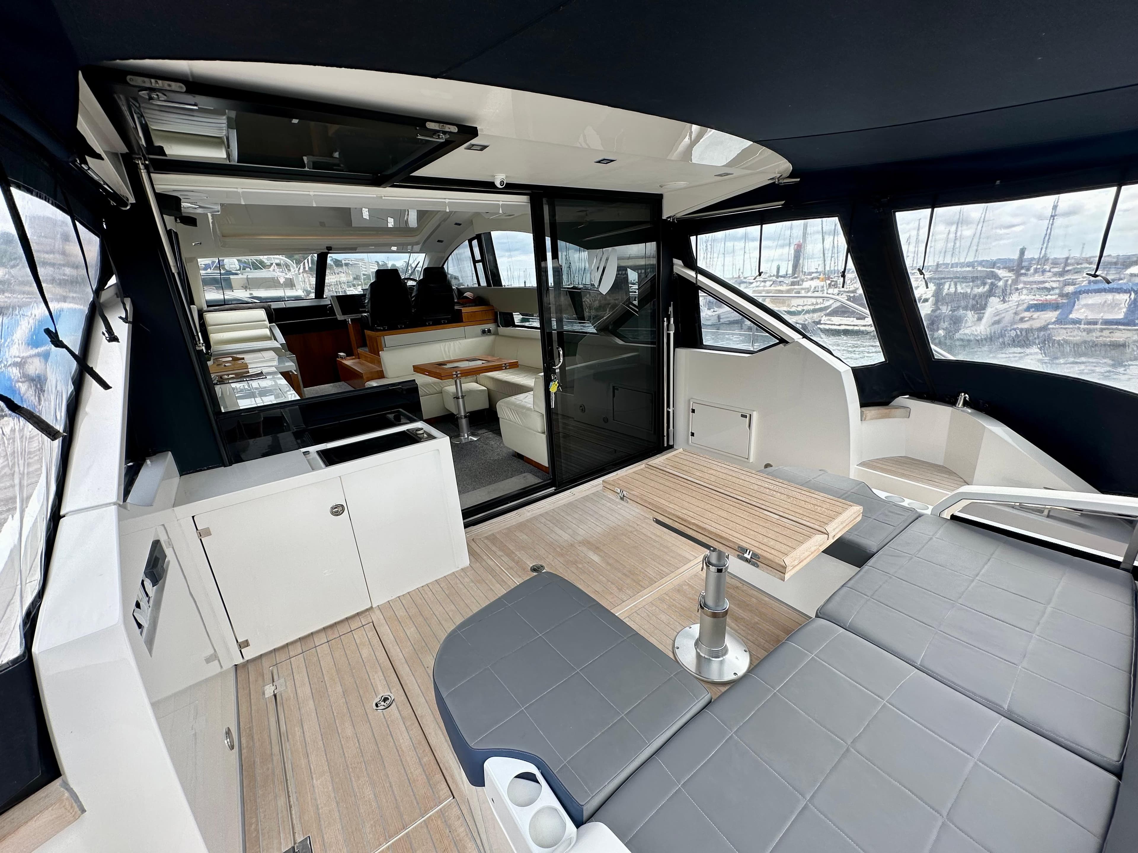 Luxurious 2012 Fairline Targa 50 GT yacht interior with modern seating and wooden accents.