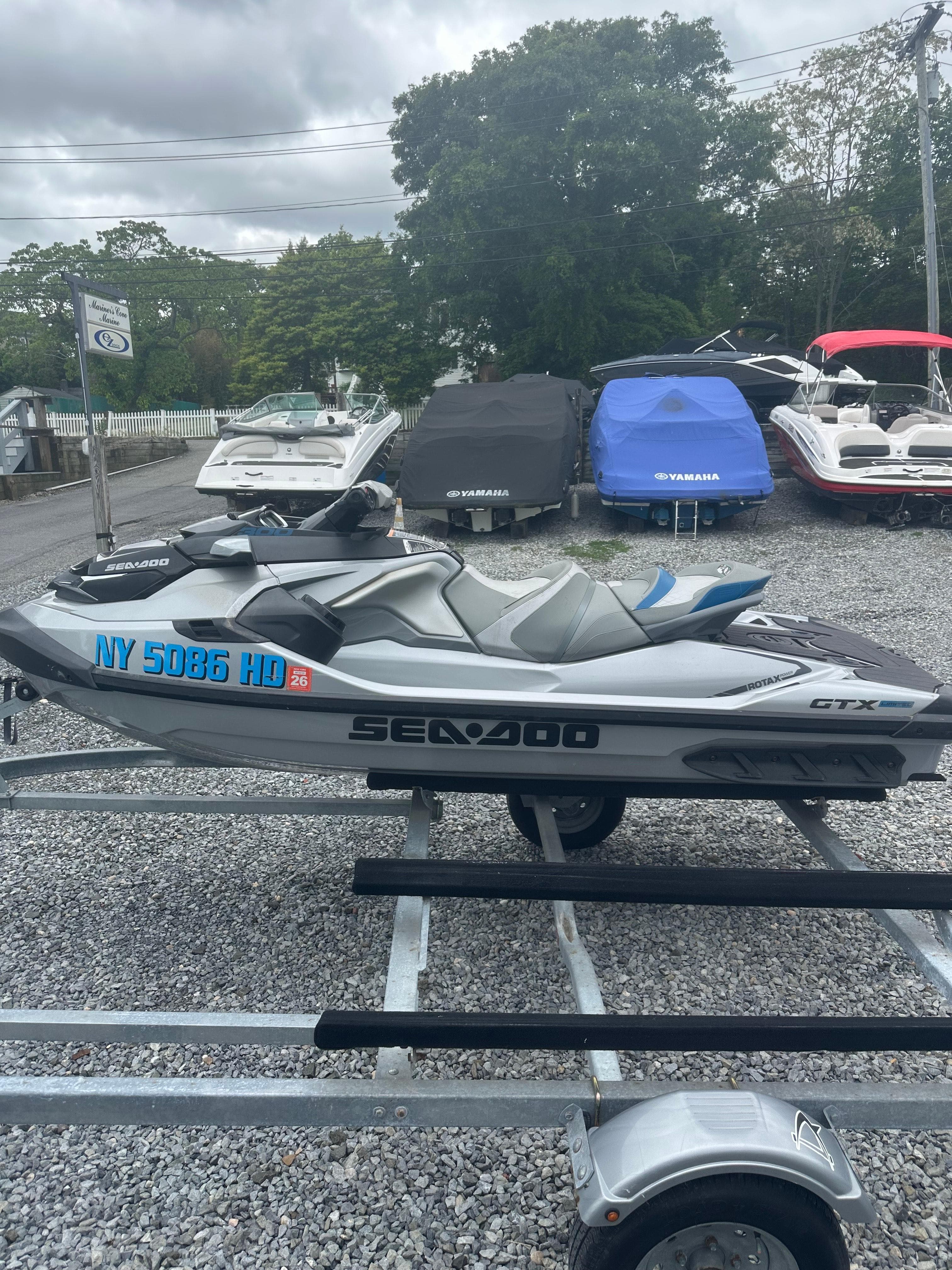 2020 Sea-Doo GTX Limited 300 jet ski on trailer, parked outdoors.
