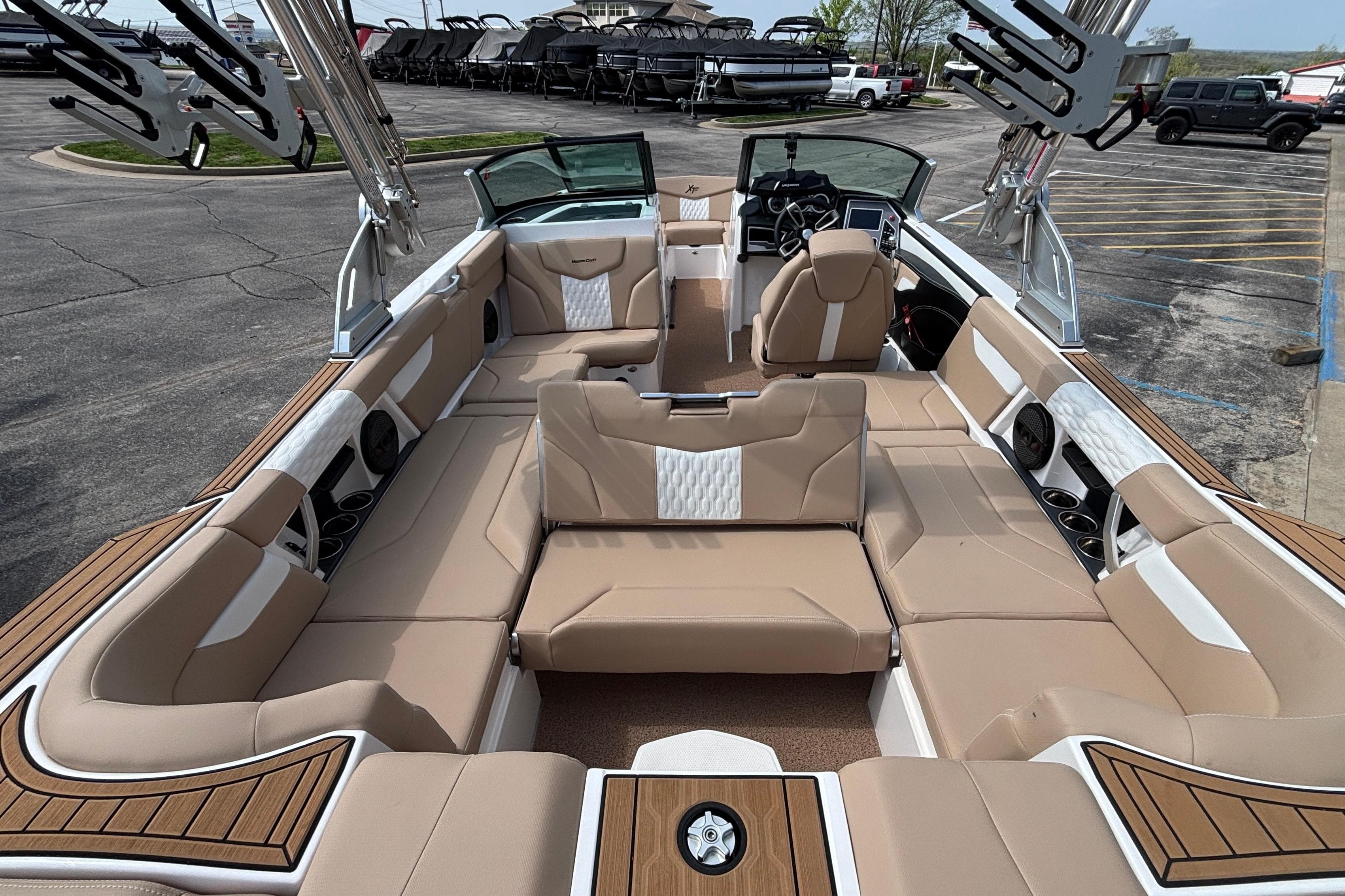 2024 MasterCraft XT24 boat interior with luxurious tan seating and modern design.