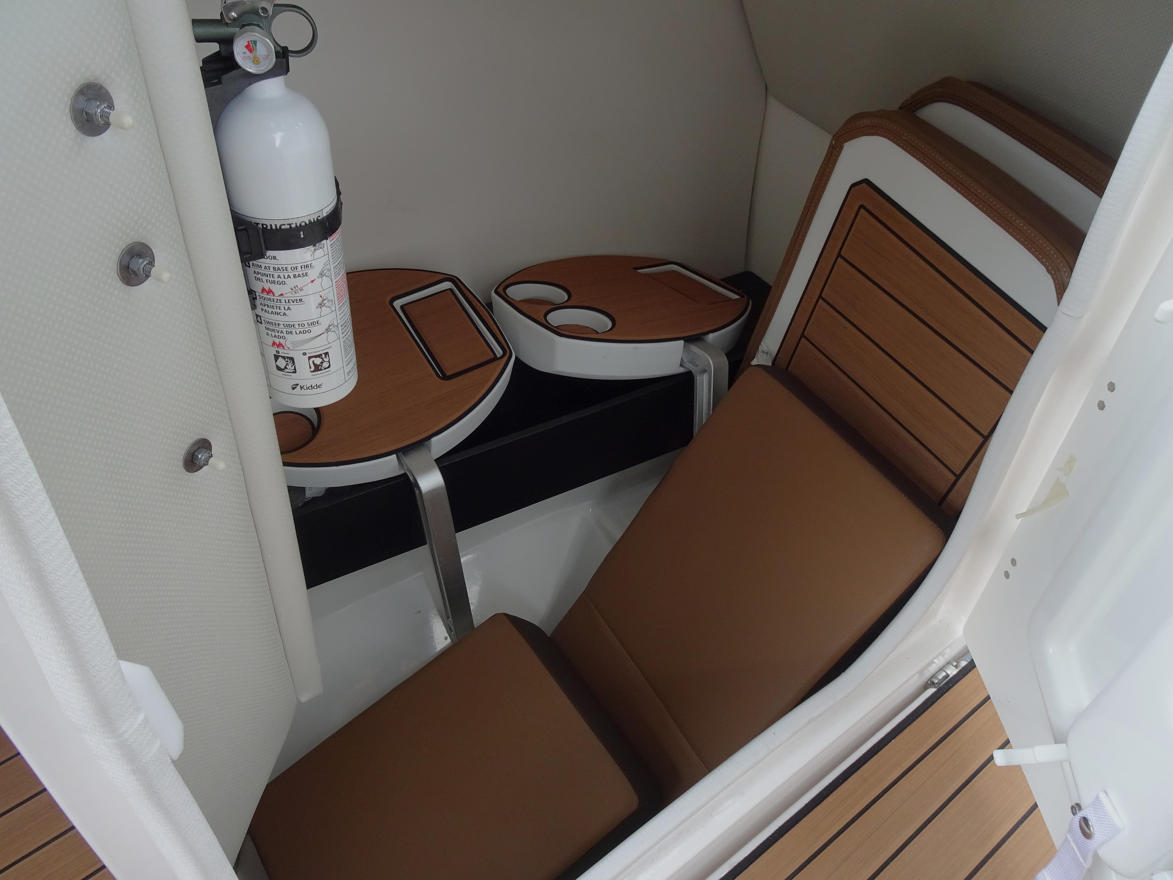 2024 Yamaha Boats 252SE interior with seating and fire extinguisher.