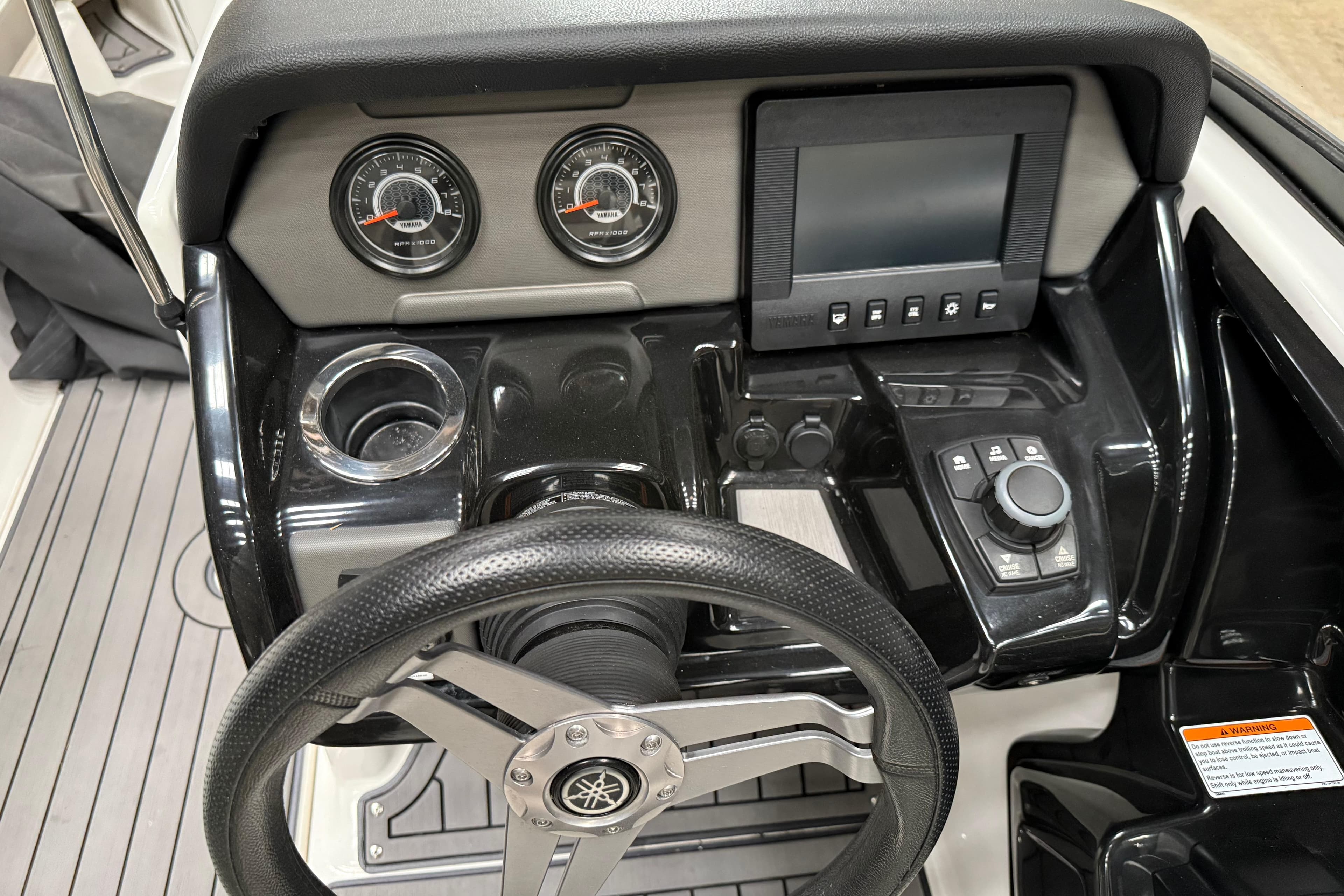 Dashboard of 2018 Yamaha Boats 212 Limited S with steering wheel and controls.